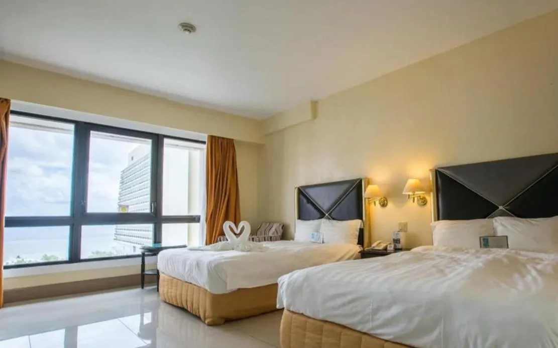 Bed in Royal Orchid Hotel Guam