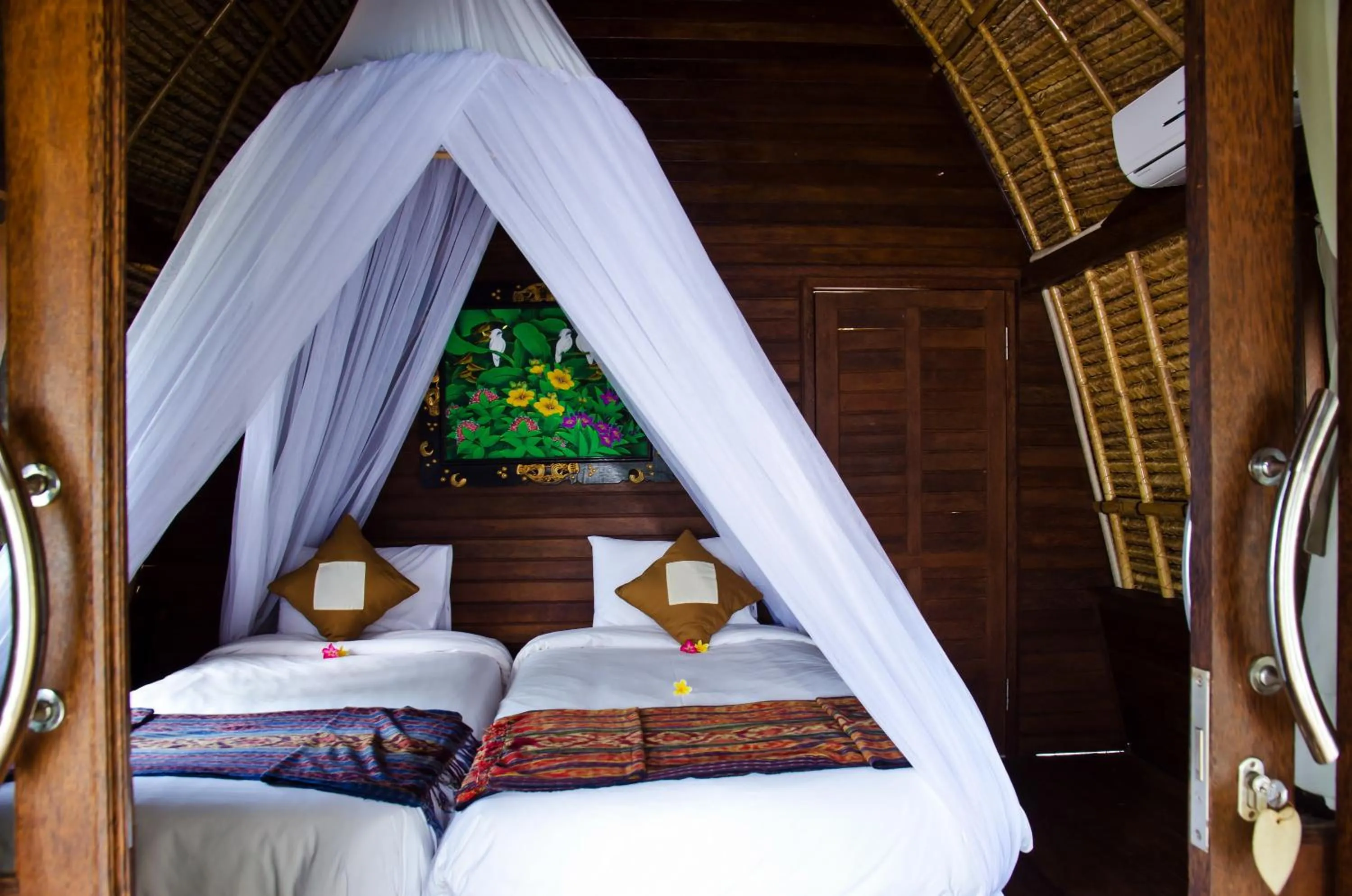 Photo of the whole room, Bed in Lotus Garden Huts