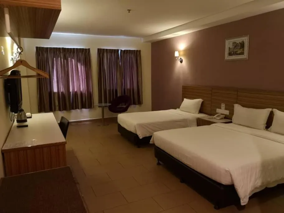 Bed in Grand Court Hotel