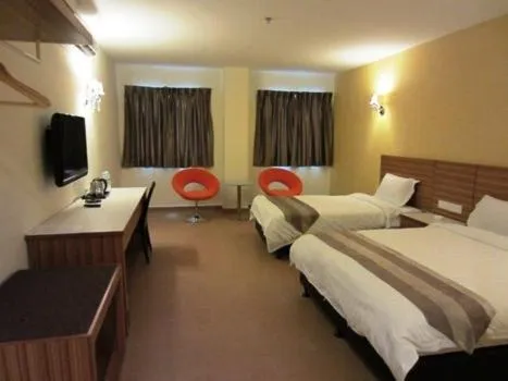 Bed in Grand Court Hotel