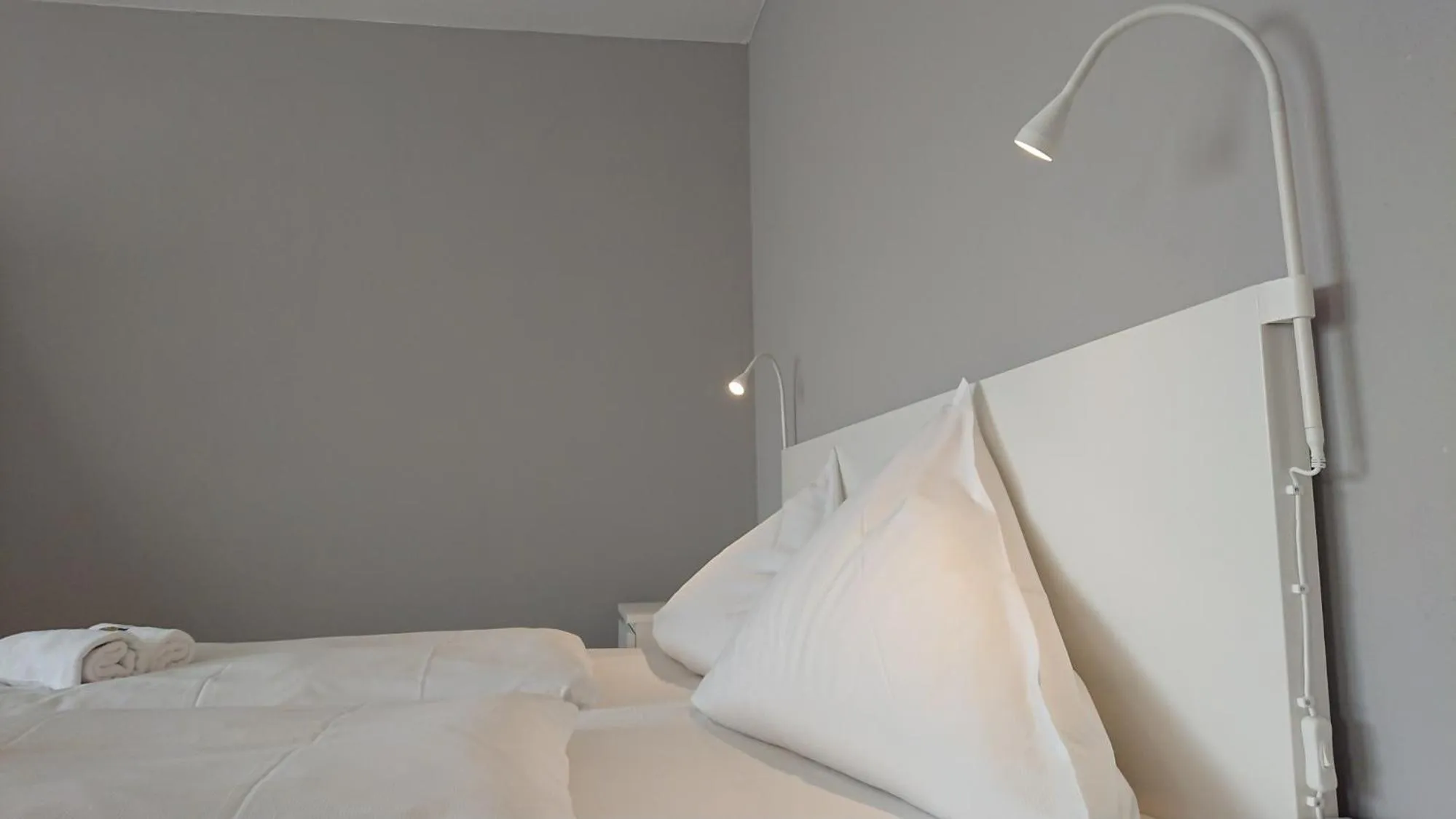 Bed in Ostseehotel Kappeln by team SchleiFee