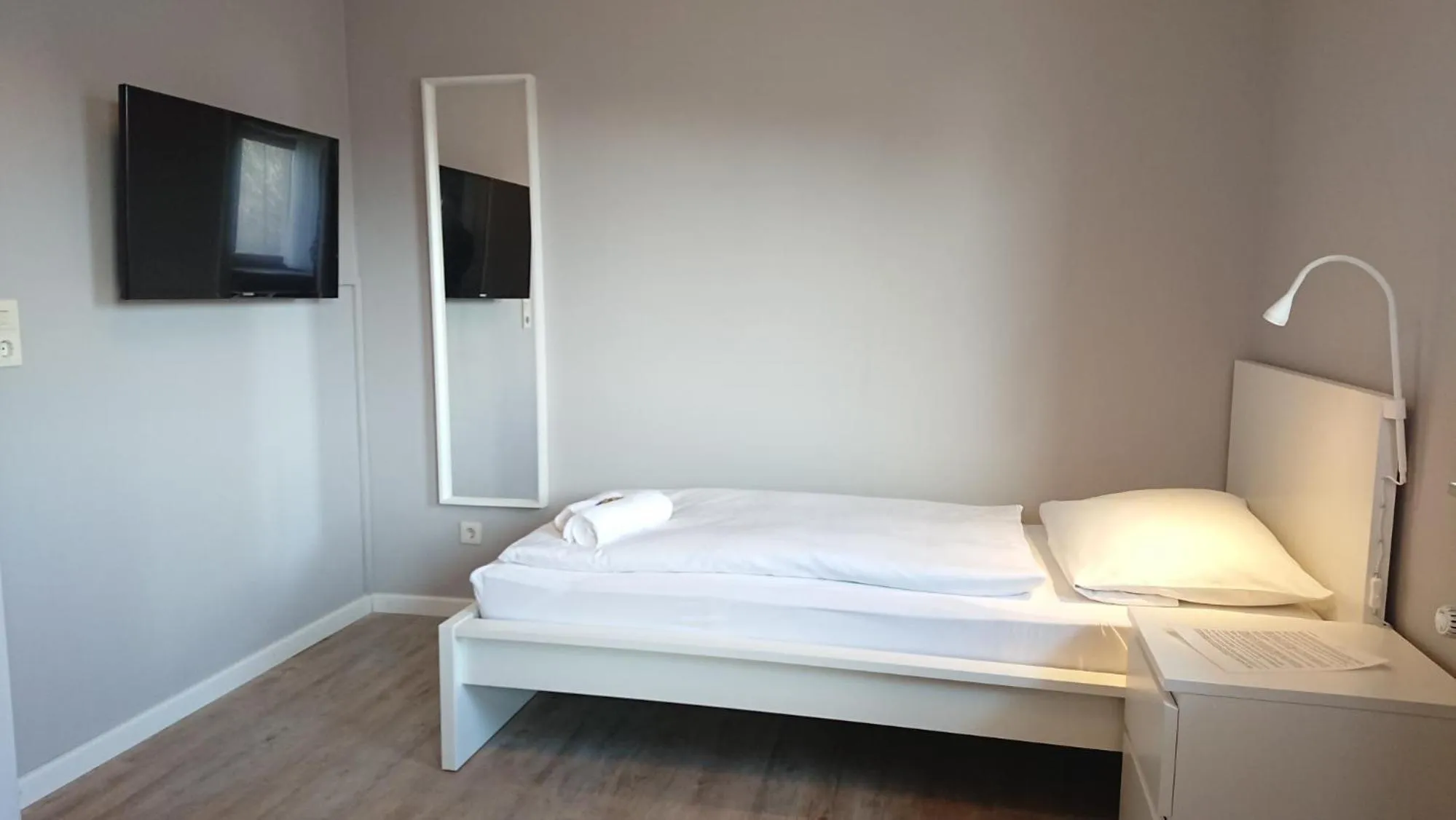Bed in Ostseehotel Kappeln by team SchleiFee