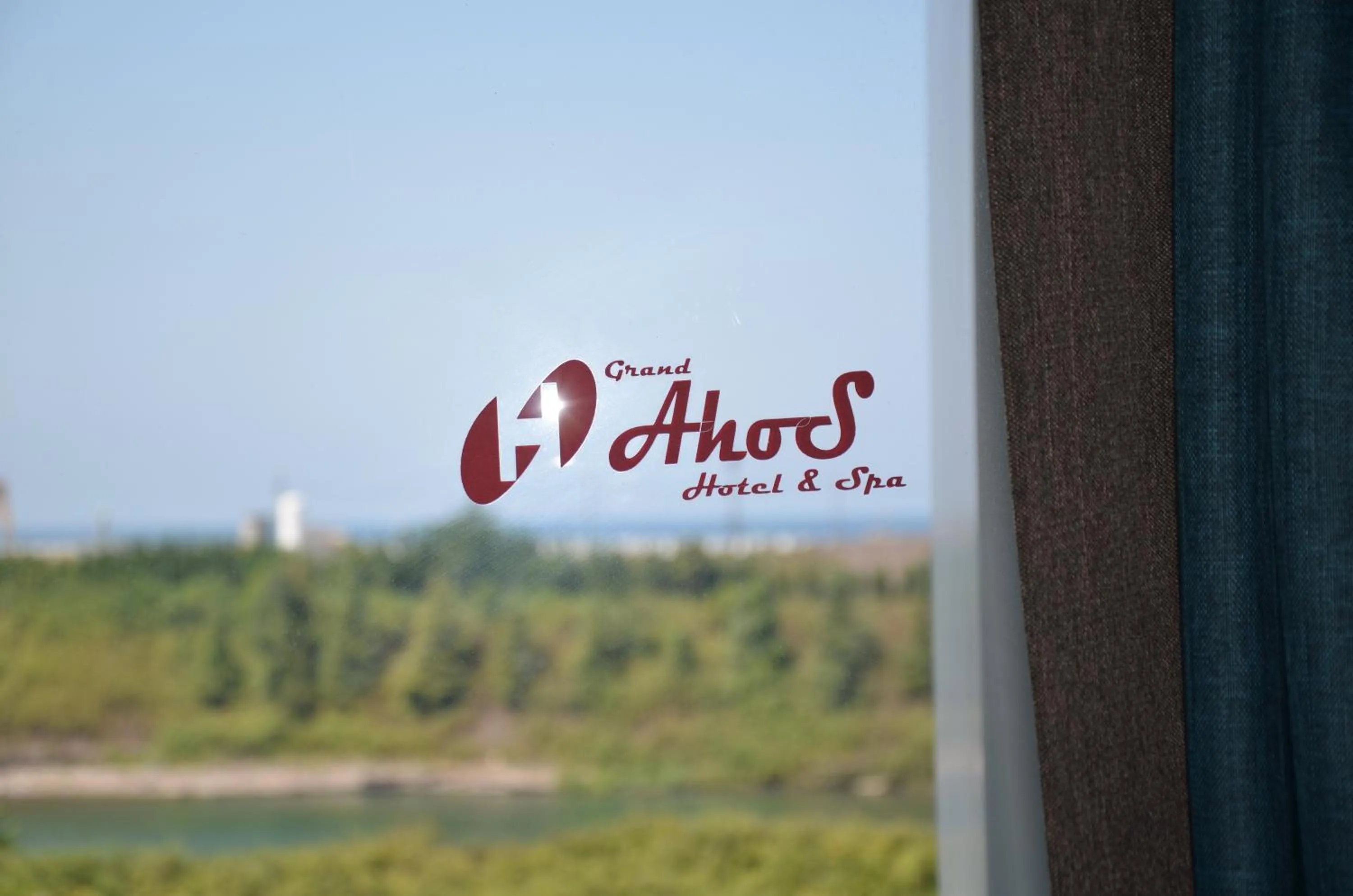 Property logo or sign in Grand Ahos Hotel