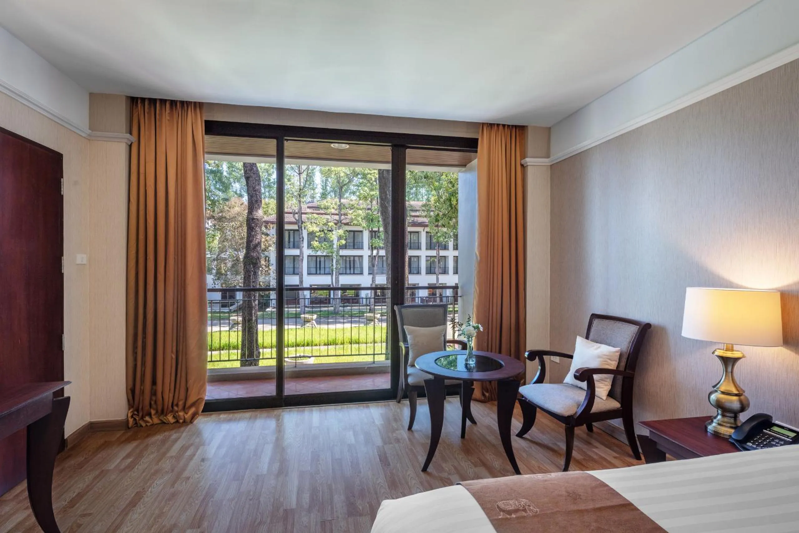 Bed in Tawa Ravadee Resort Prachinburi, a member of WorldHotels Distinctive