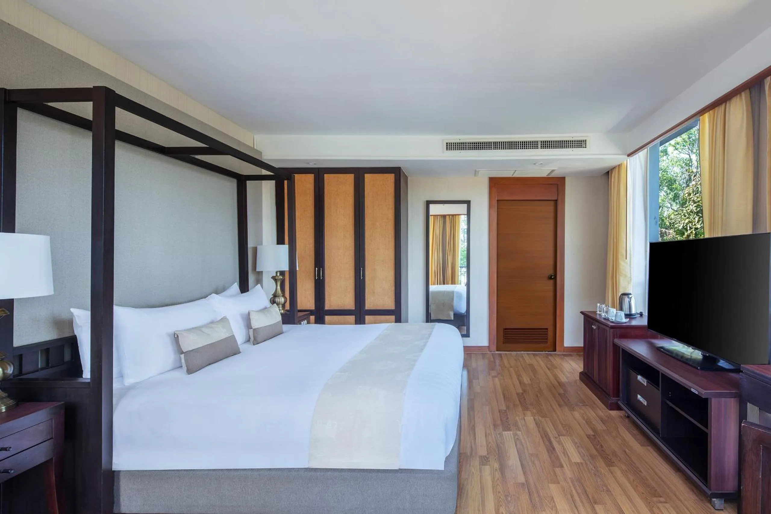 Bed in Tawa Ravadee Resort Prachinburi, a member of WorldHotels Distinctive