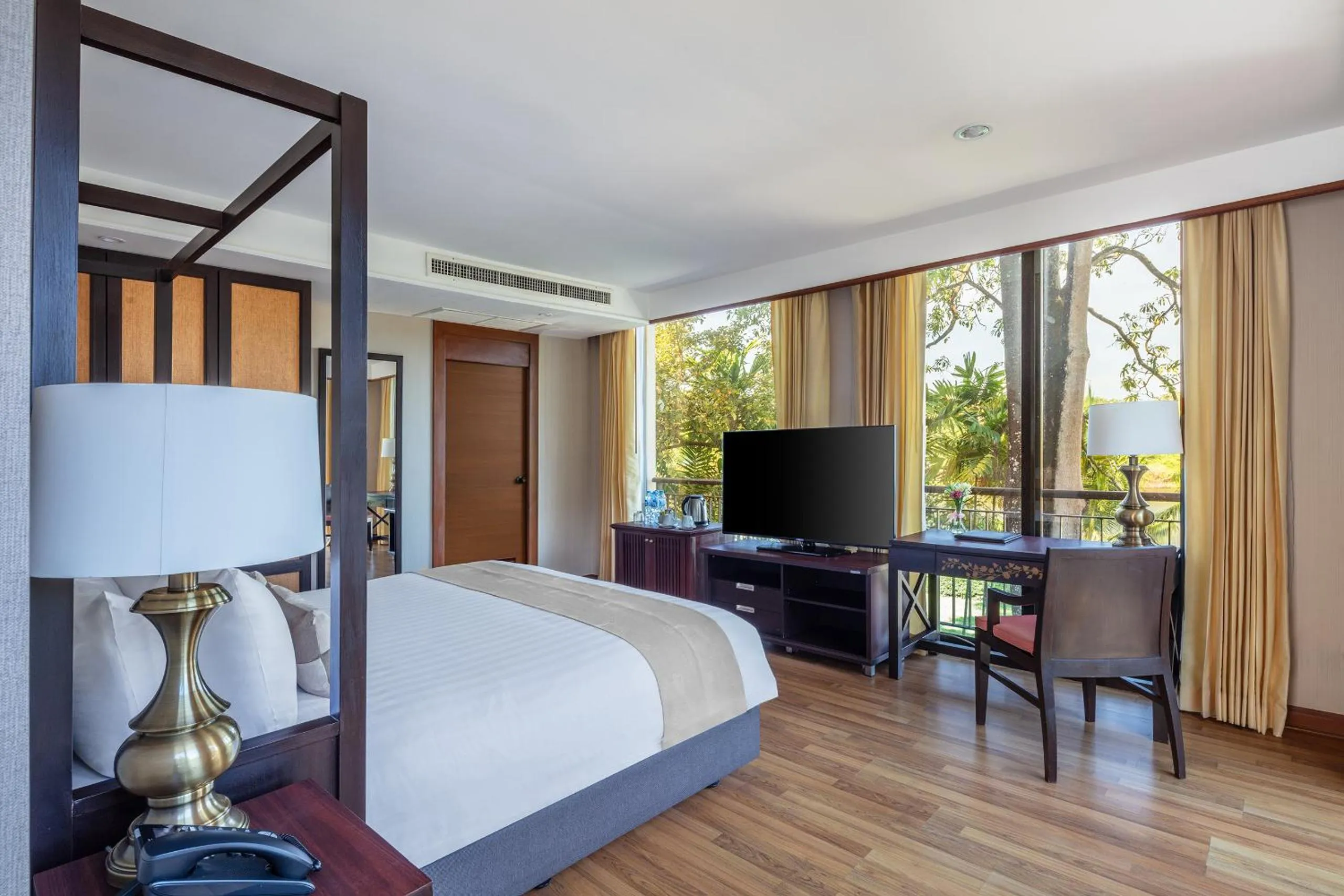 Bed in Tawa Ravadee Resort Prachinburi, a member of WorldHotels Distinctive