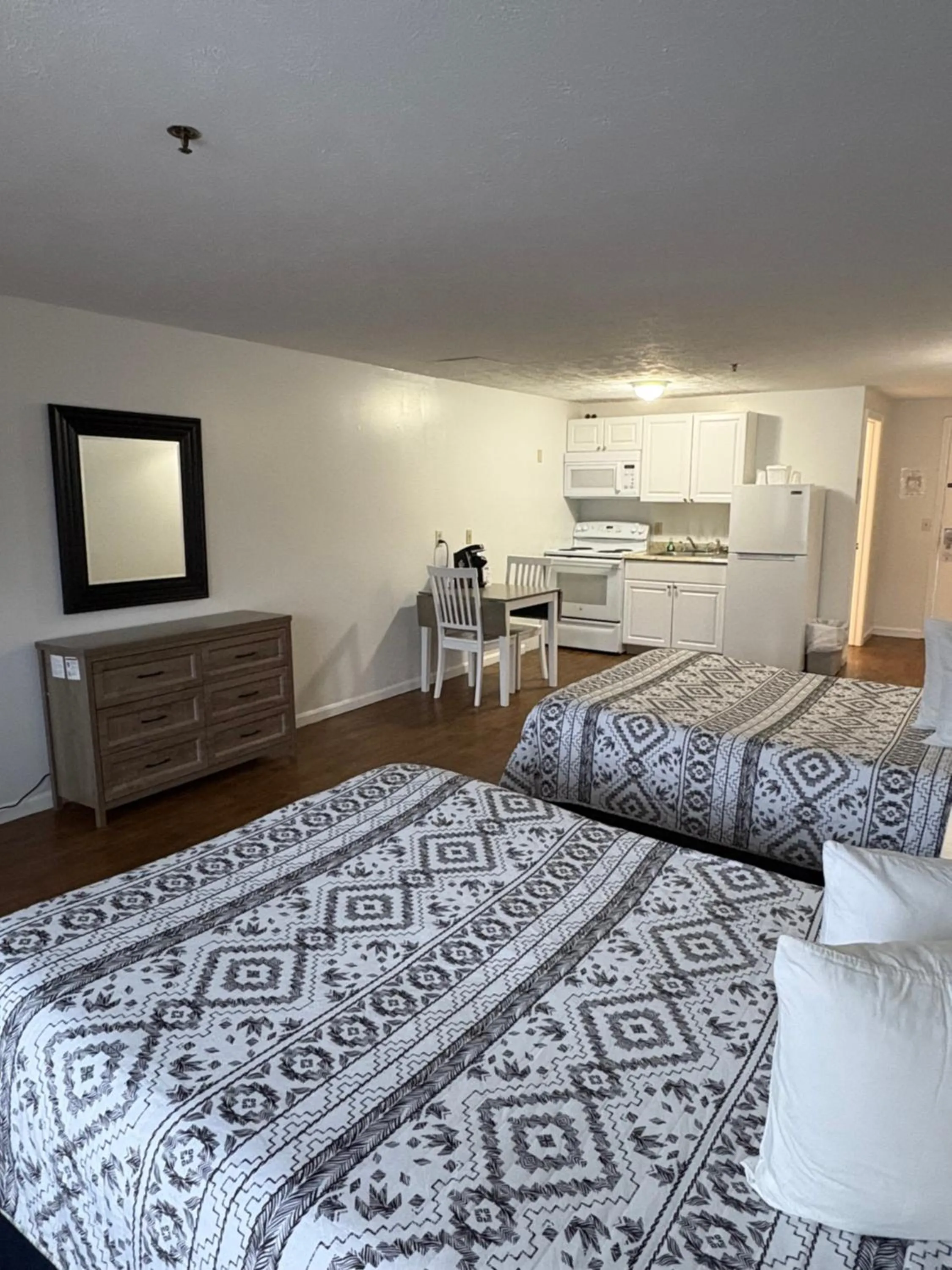 Bed in The Grand Beach Inn