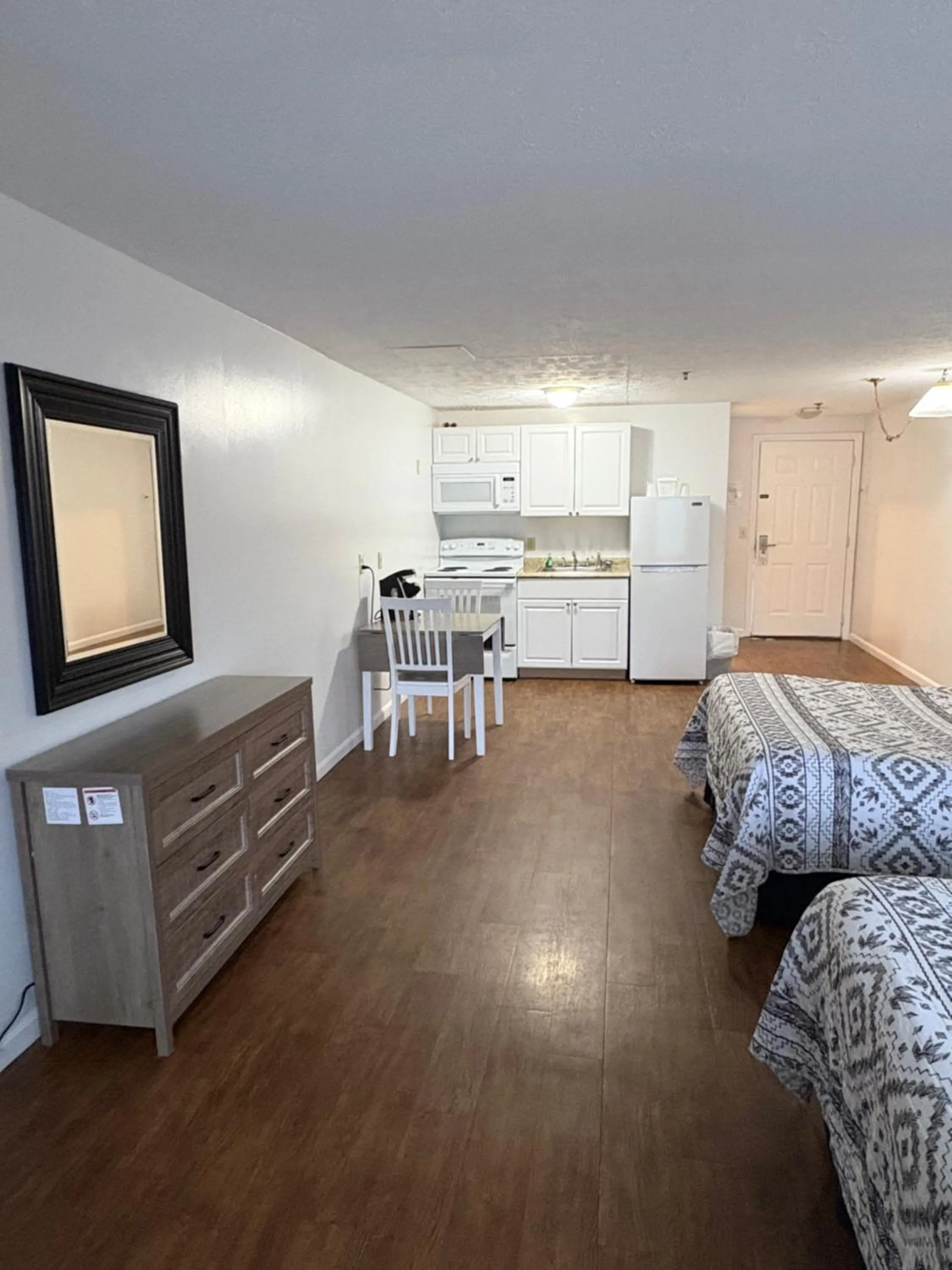 Bed in The Grand Beach Inn