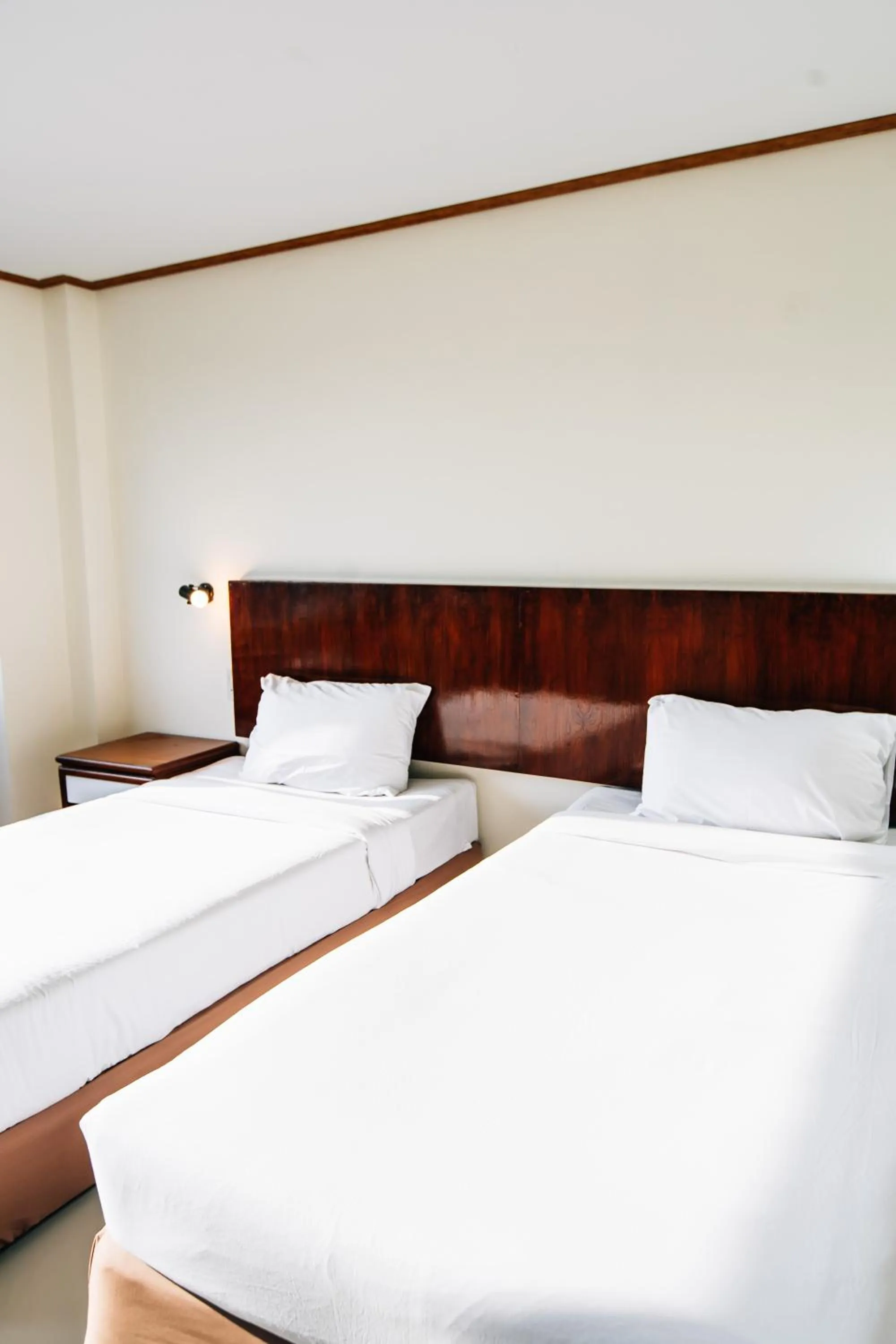 Bed in Sinkiat Thani Hotel