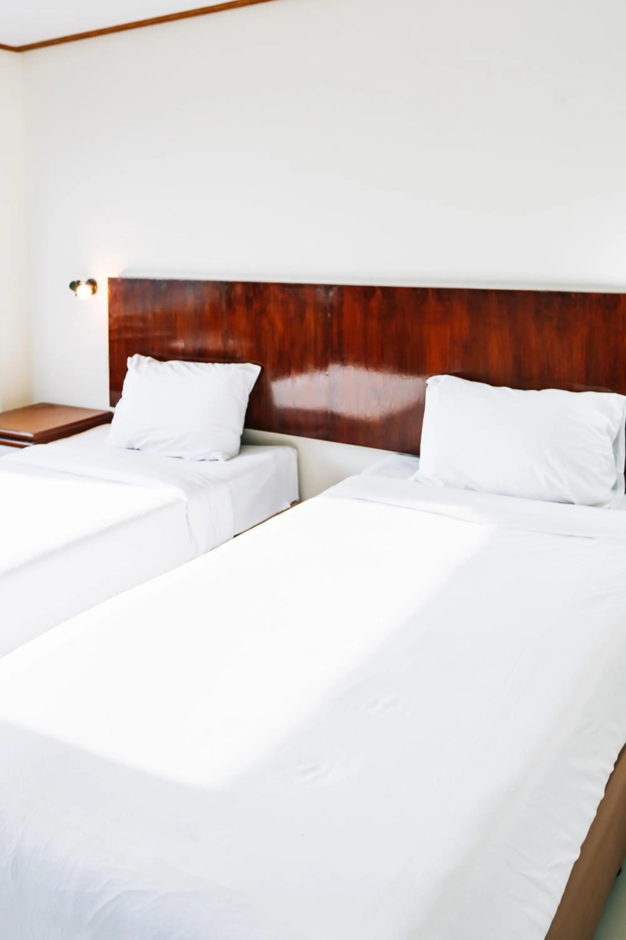 Bed in Sinkiat Thani Hotel