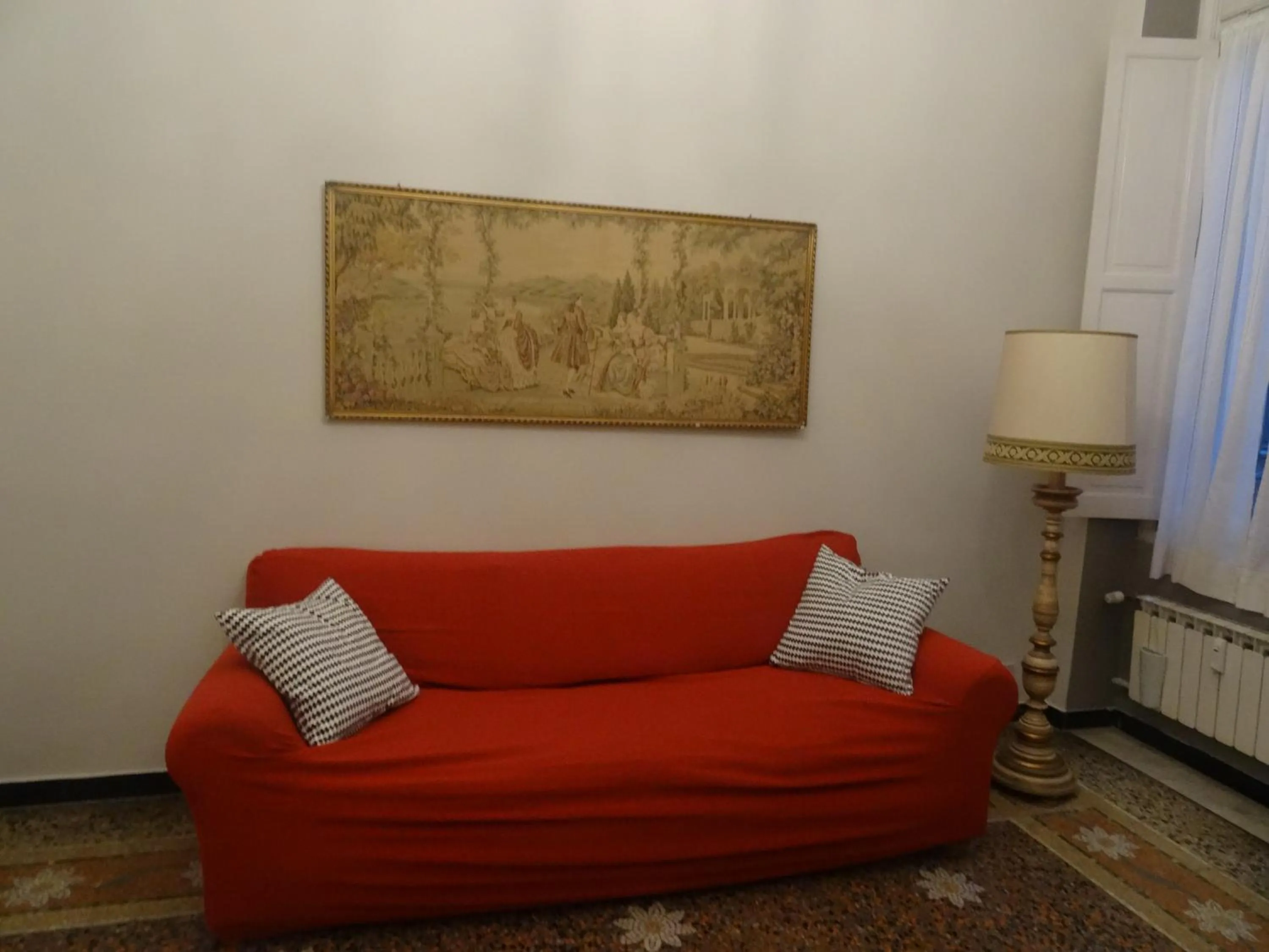 Communal lounge/ TV room in Albergo Locanda Alambra