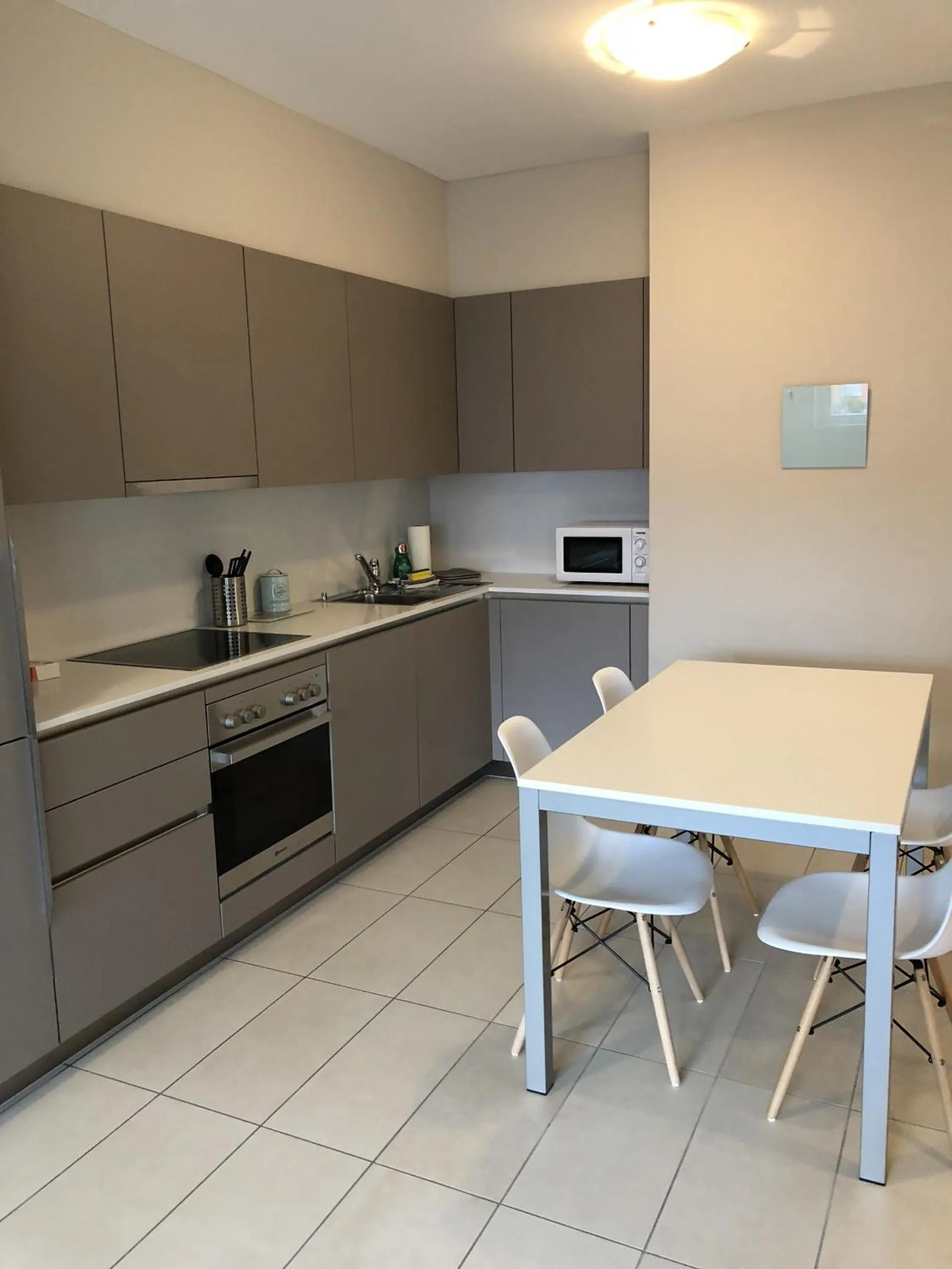 Kitchen or kitchenette in Prestige Apartments by Quokka 360 - spacious flats with terraces