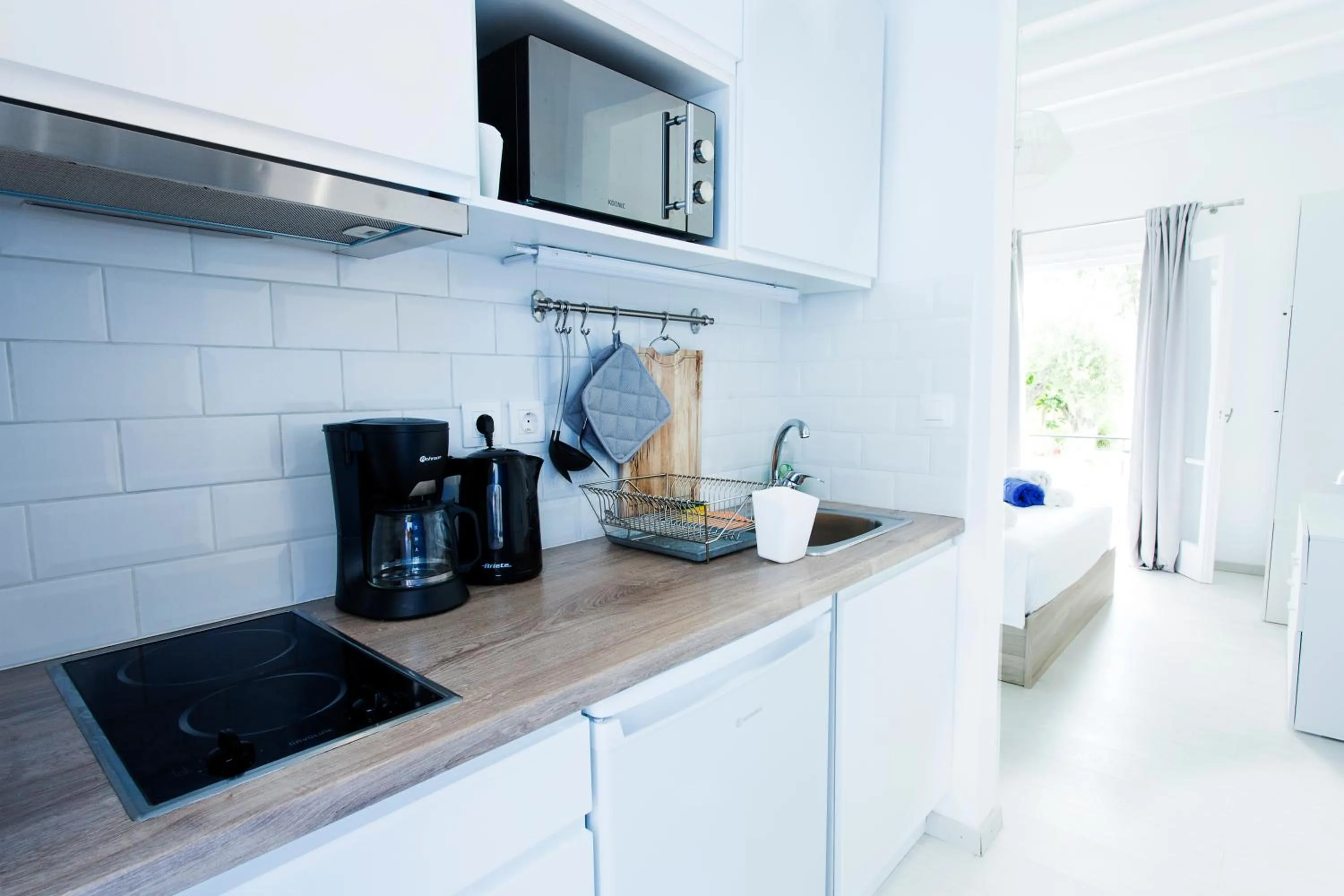 Kitchen or kitchenette in Sun 'n Chill, Boutique Apartments & Beach Villa