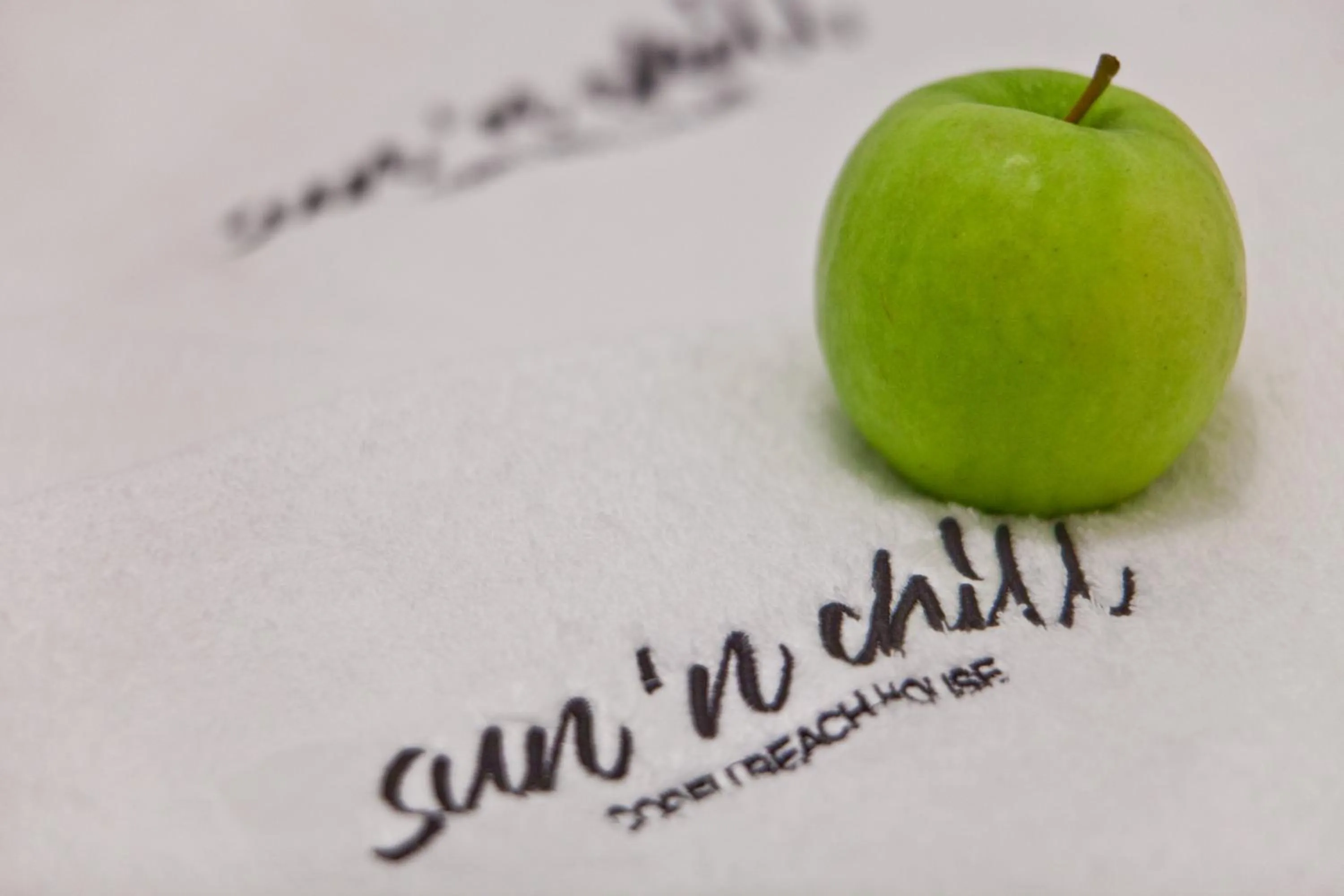 Property logo or sign in Sun 'n Chill, Boutique Apartments & Beach Villa