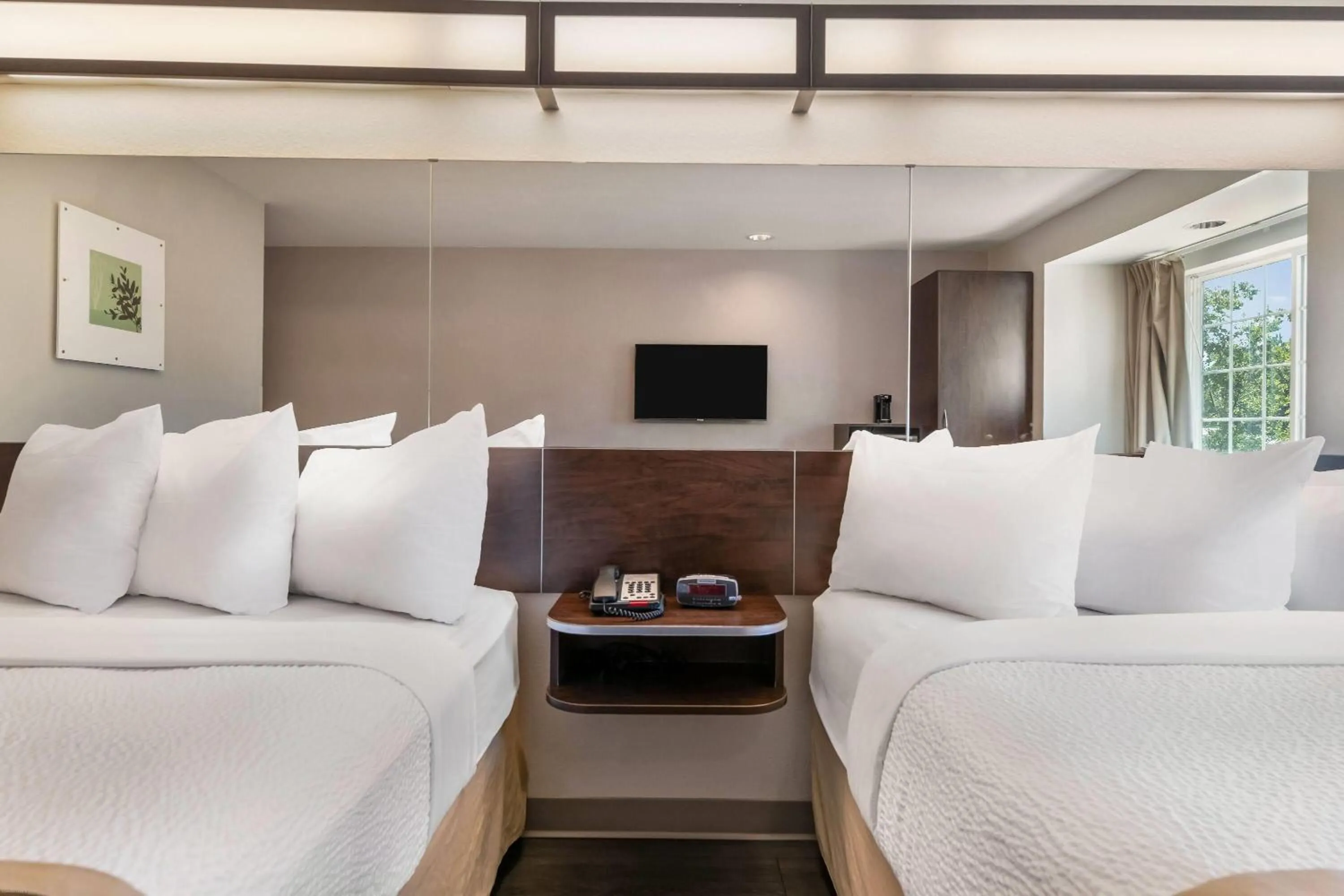 Bed in Microtel Inn & Suites by Wyndham Pearl River/Slidell