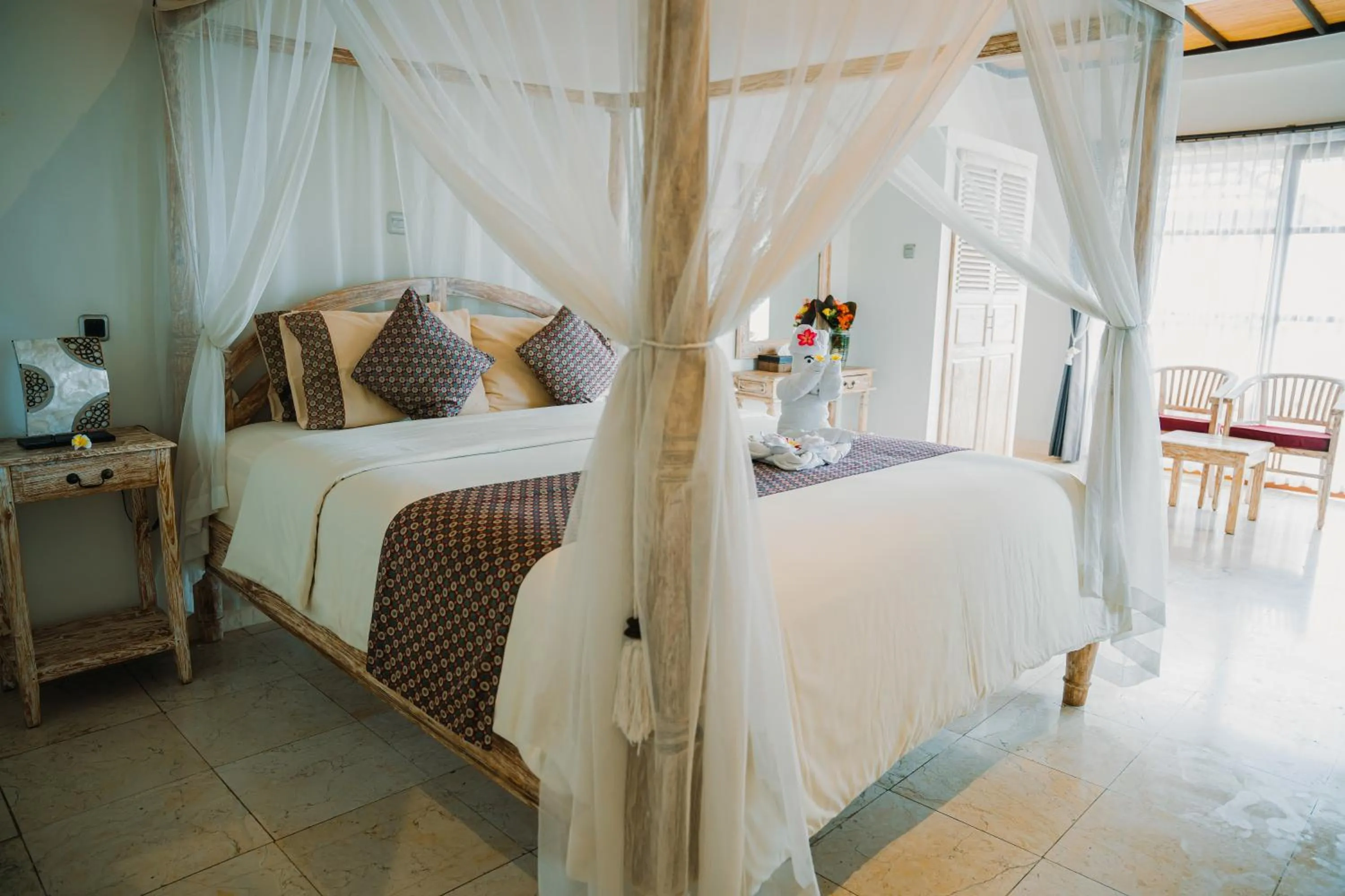 Bed in Puri Wirata Dive Resort and Spa Amed