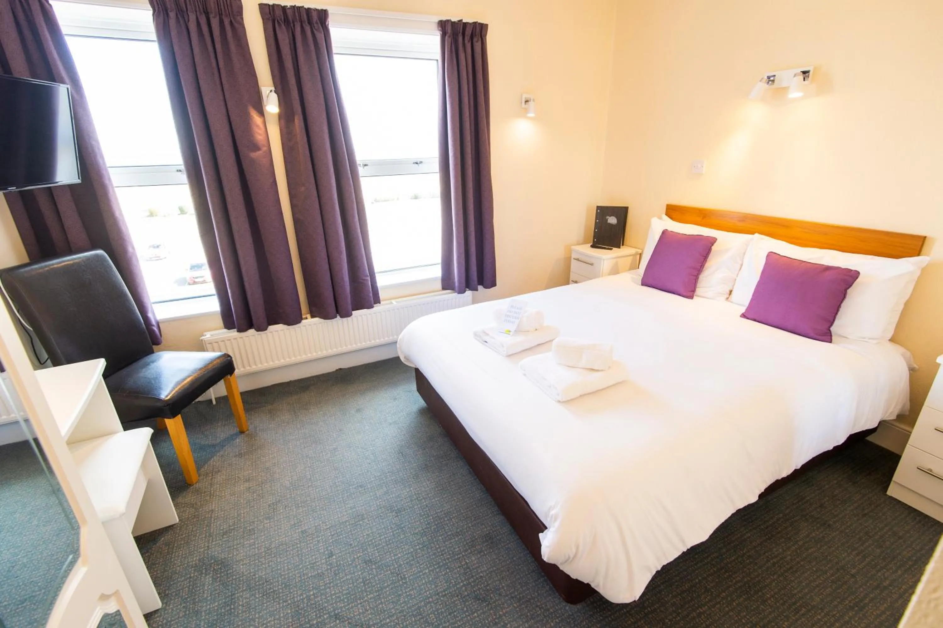 Bed in Palm Court Hotel