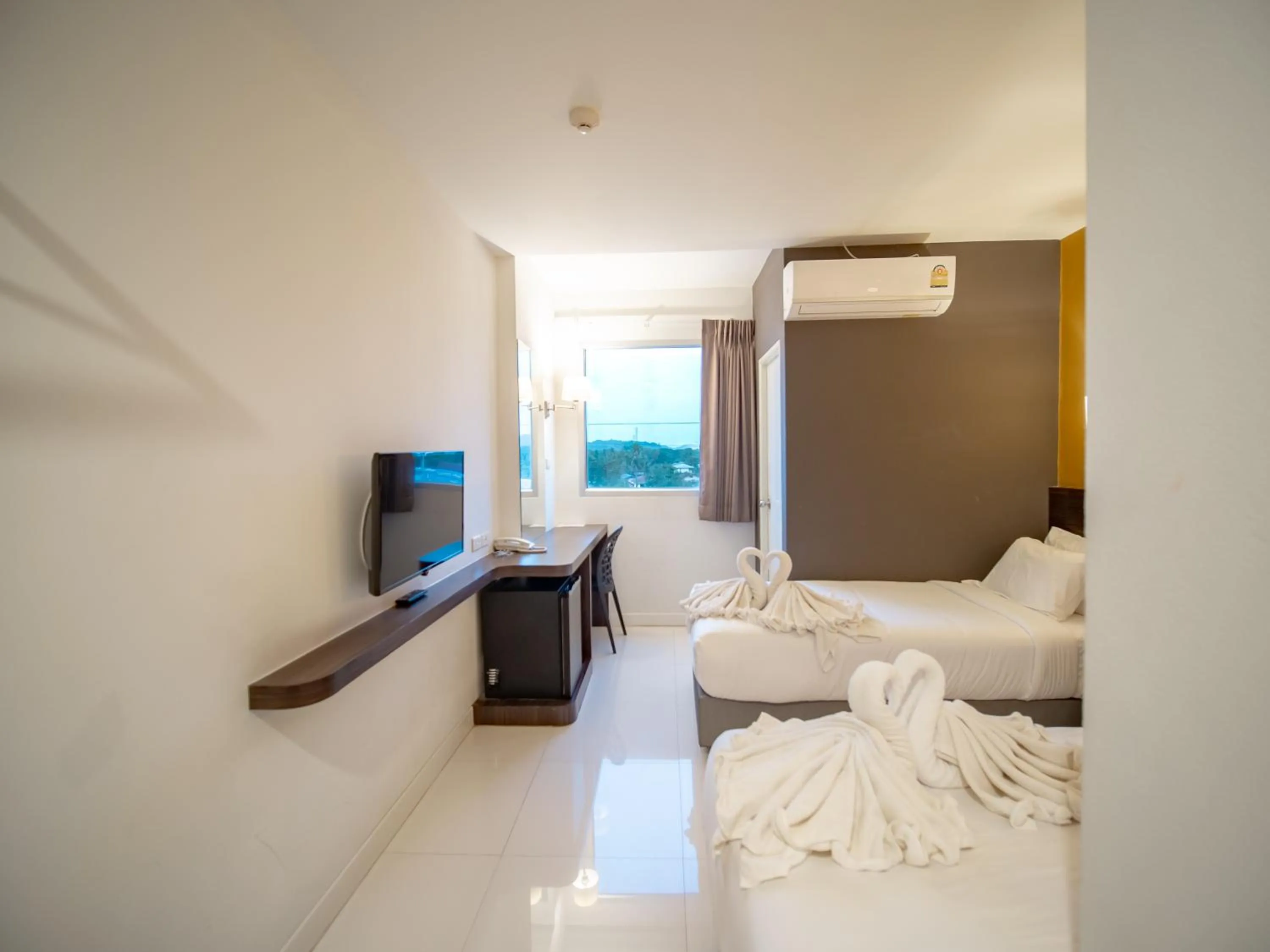 Bed in Fortune D Hotel Loei