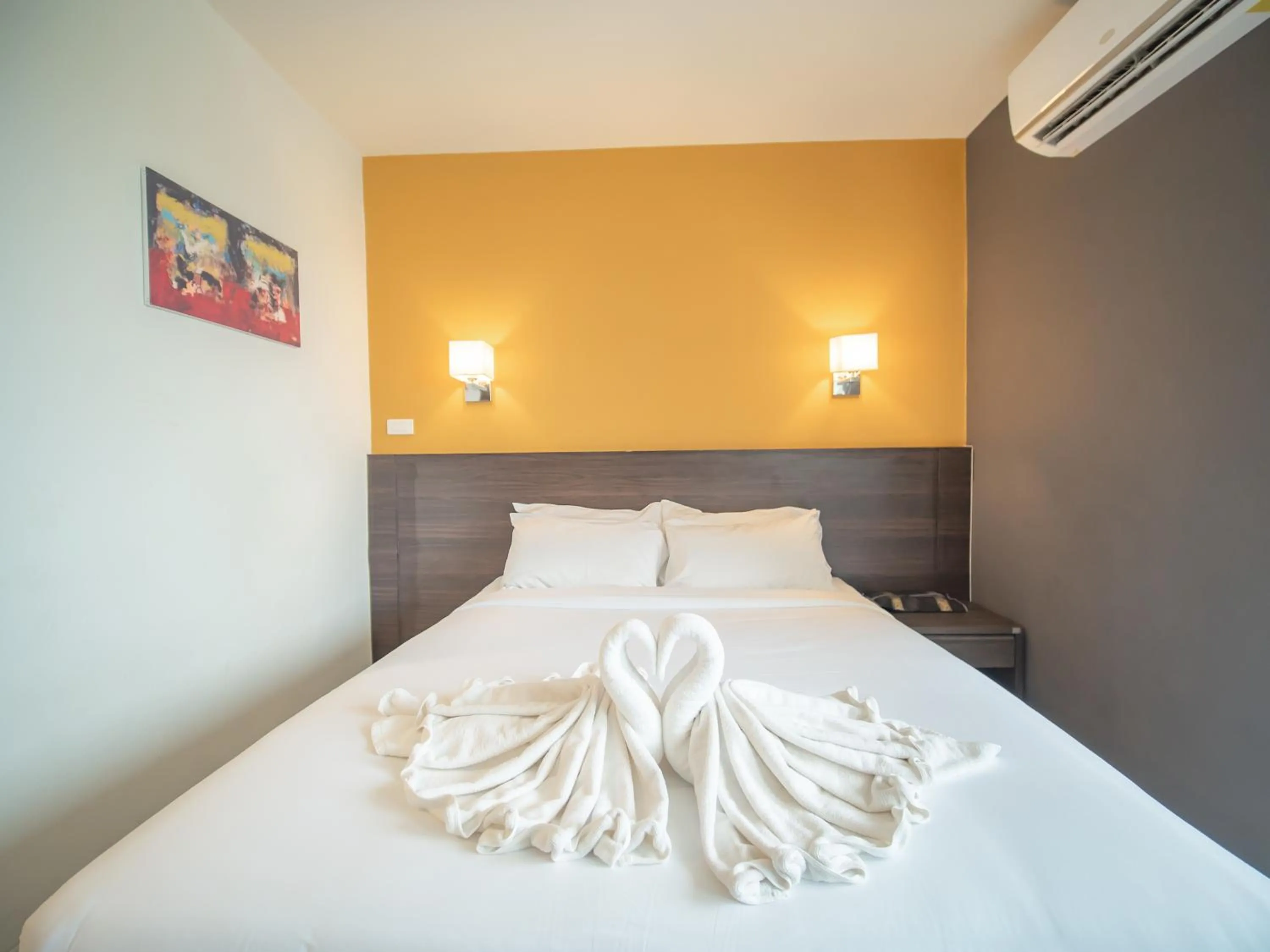 Bed in Fortune D Hotel Loei
