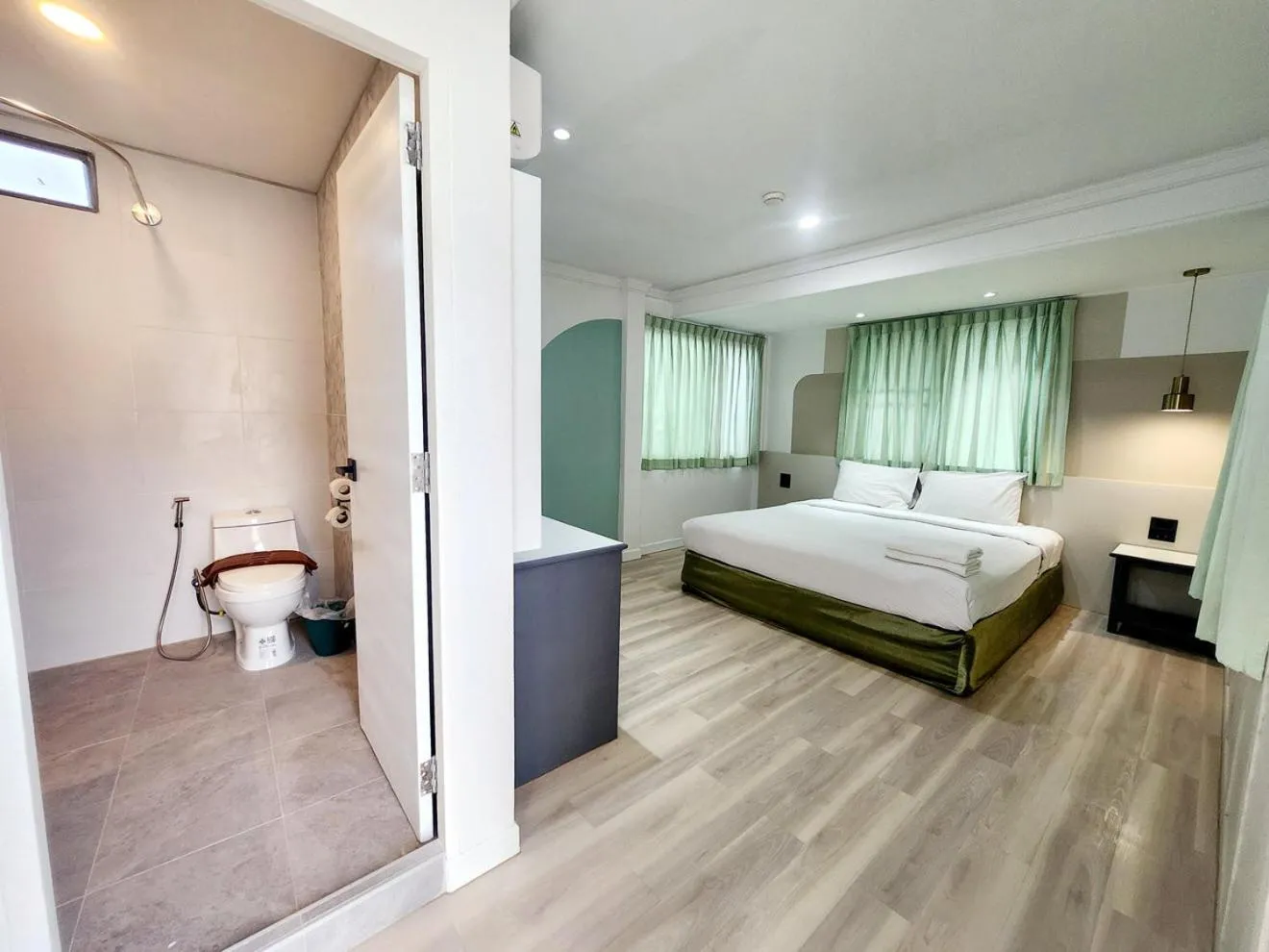 Photo of the whole room, Bed in The Green Mansion Hotel - Patong Beach