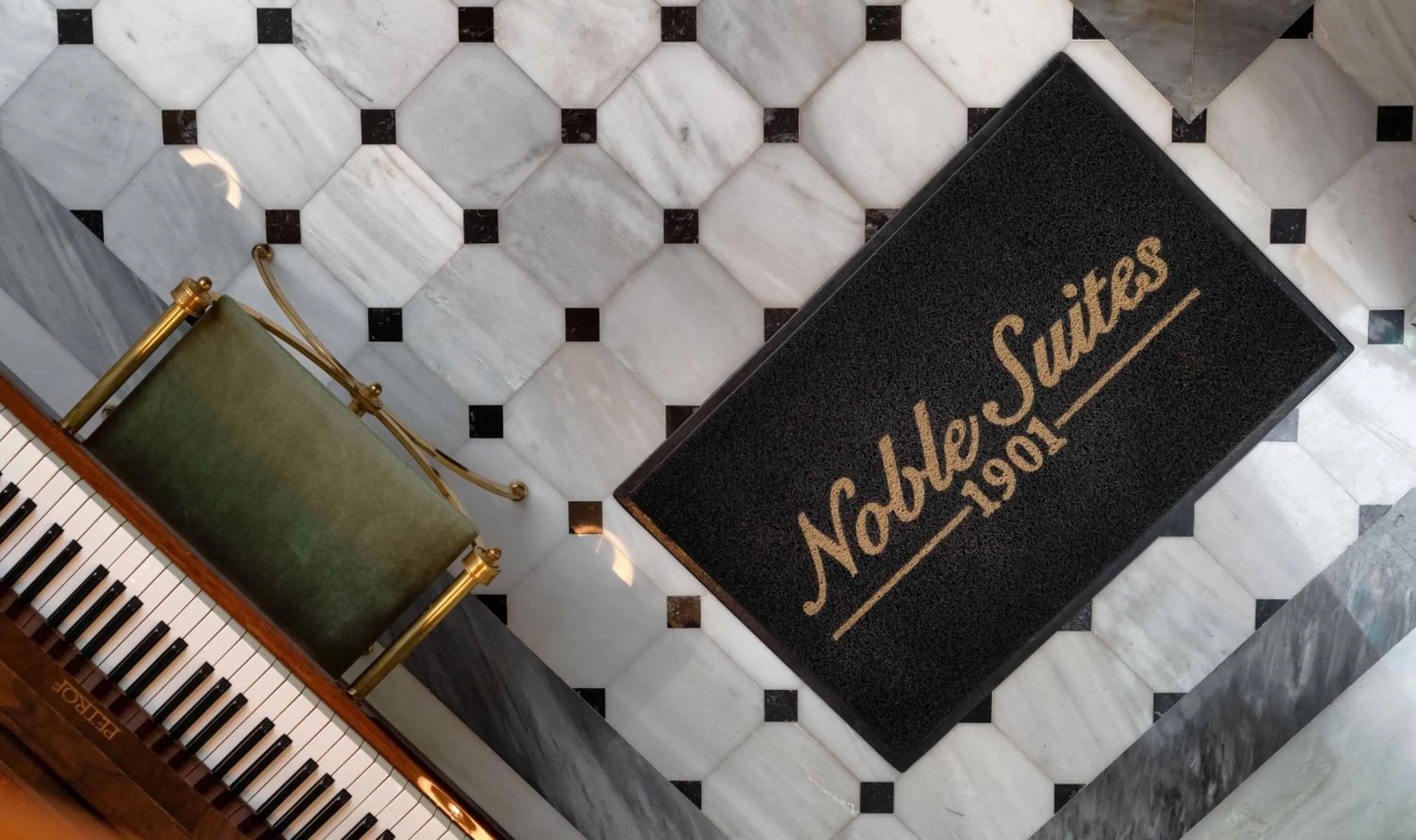 Property logo or sign in Noble Suites