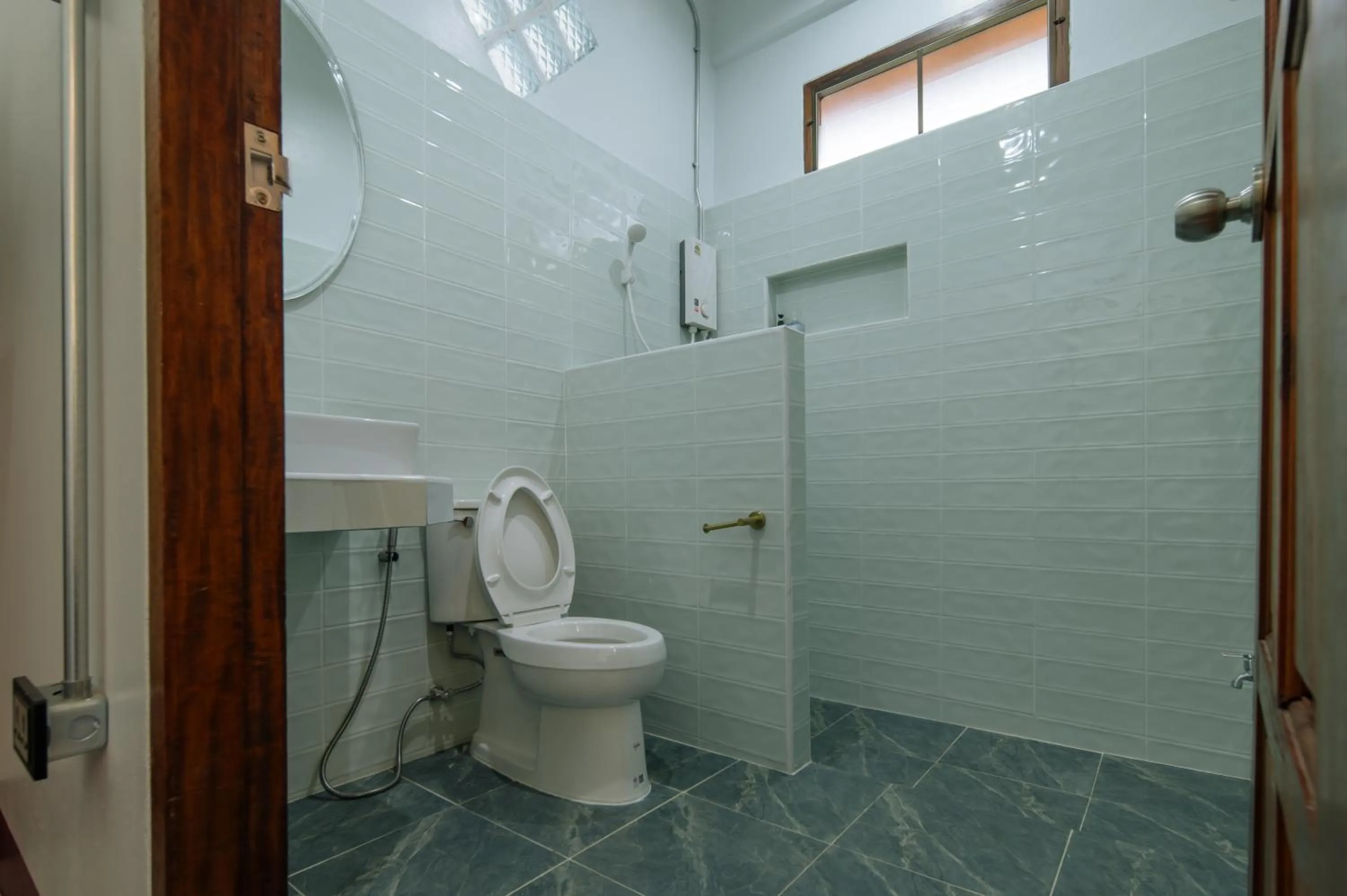 Bathroom in Pongphen Guesthouse - SHA Plus Certified