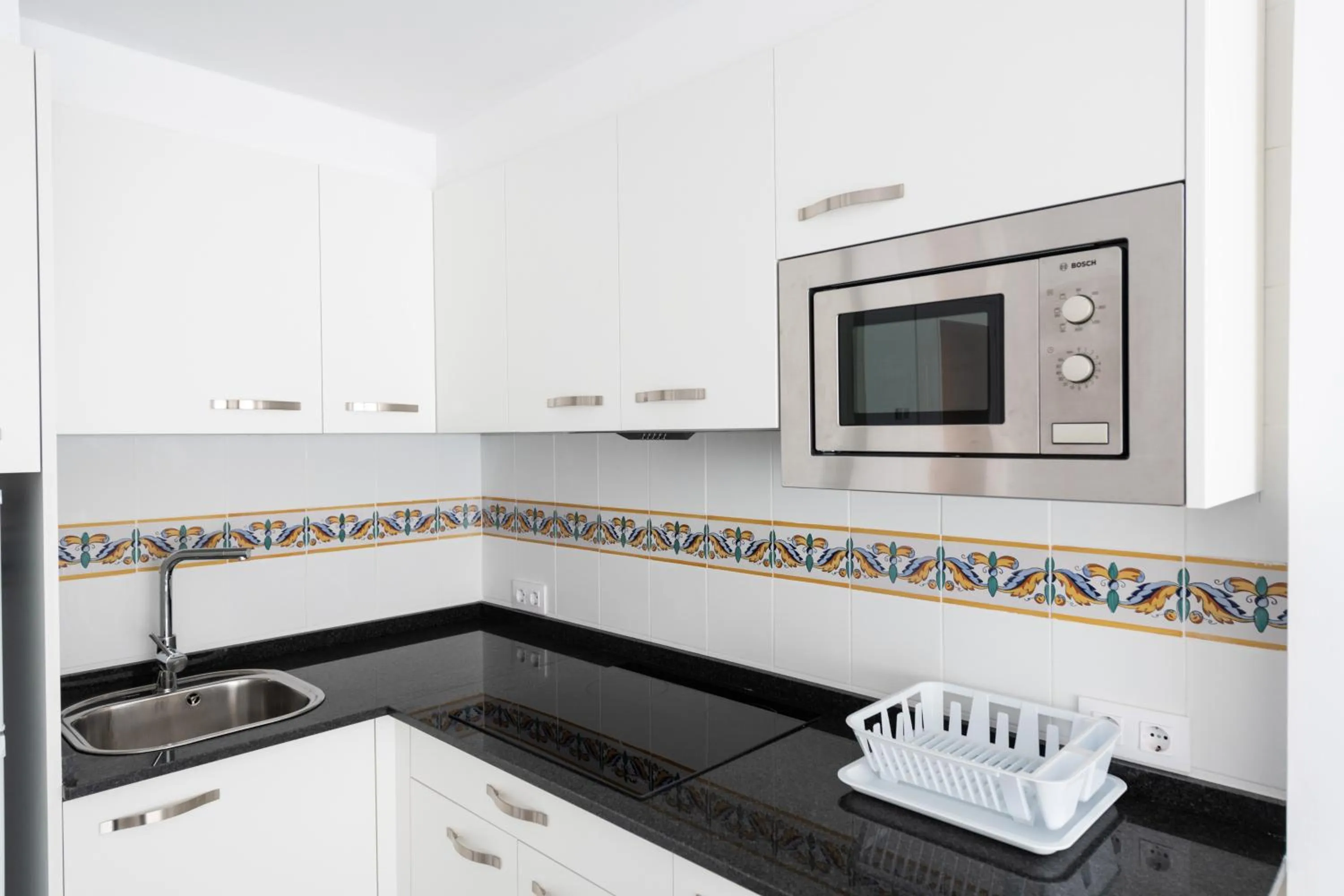 Kitchen or kitchenette in Apartamentos Marblau