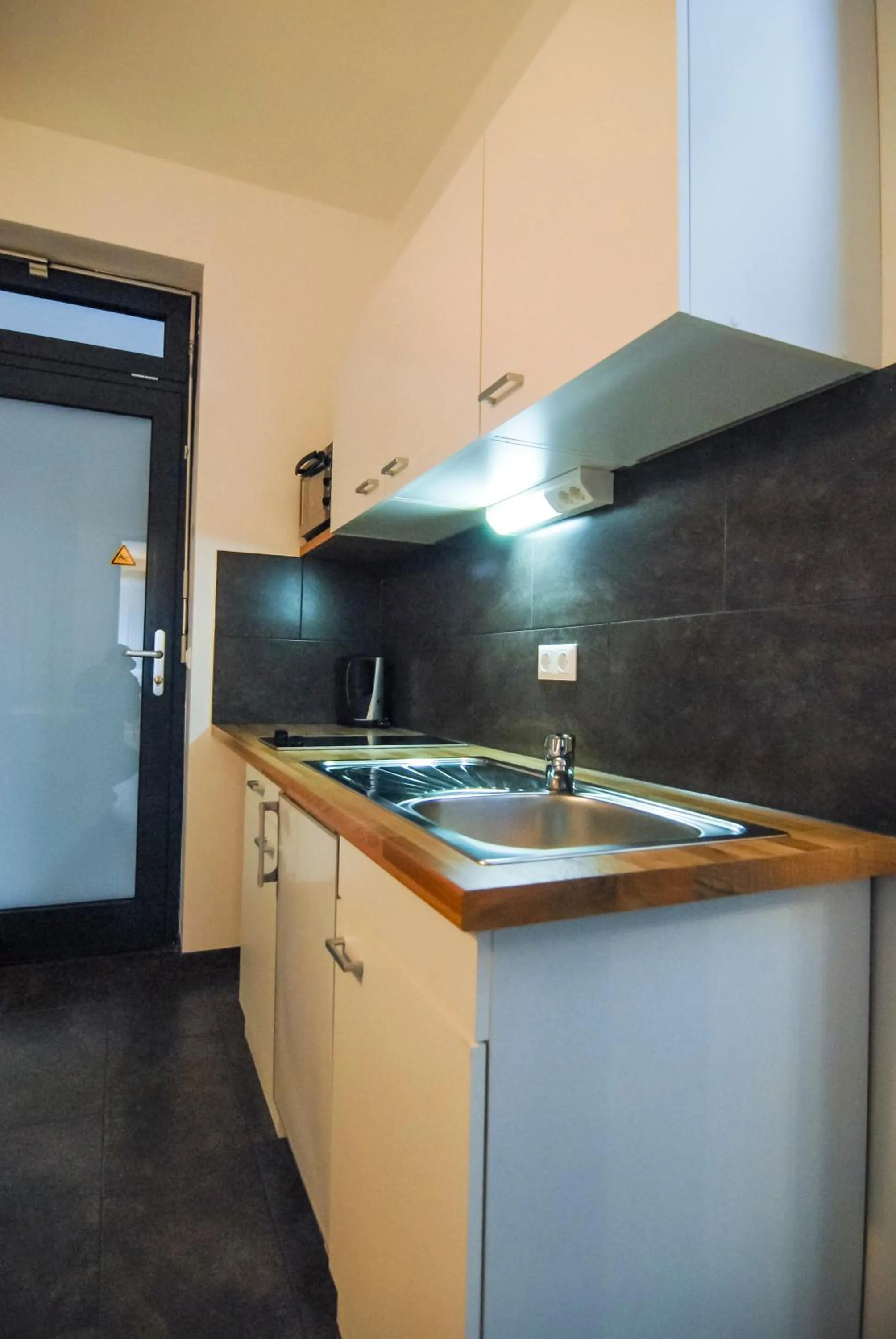 Kitchen or kitchenette in Petul Apart Hotel Am Ruhrbogen