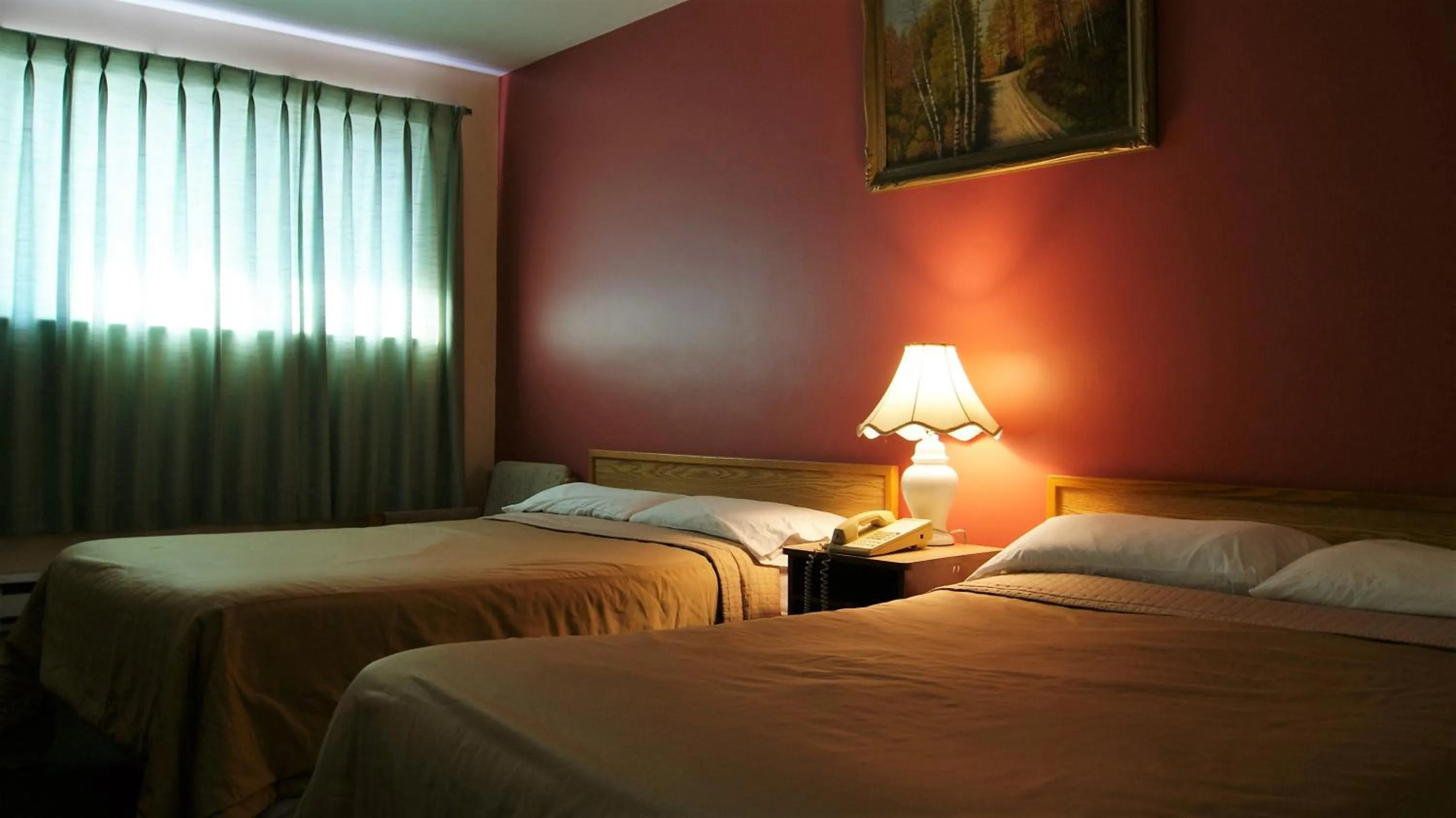 Bed in Blue Jay Motel