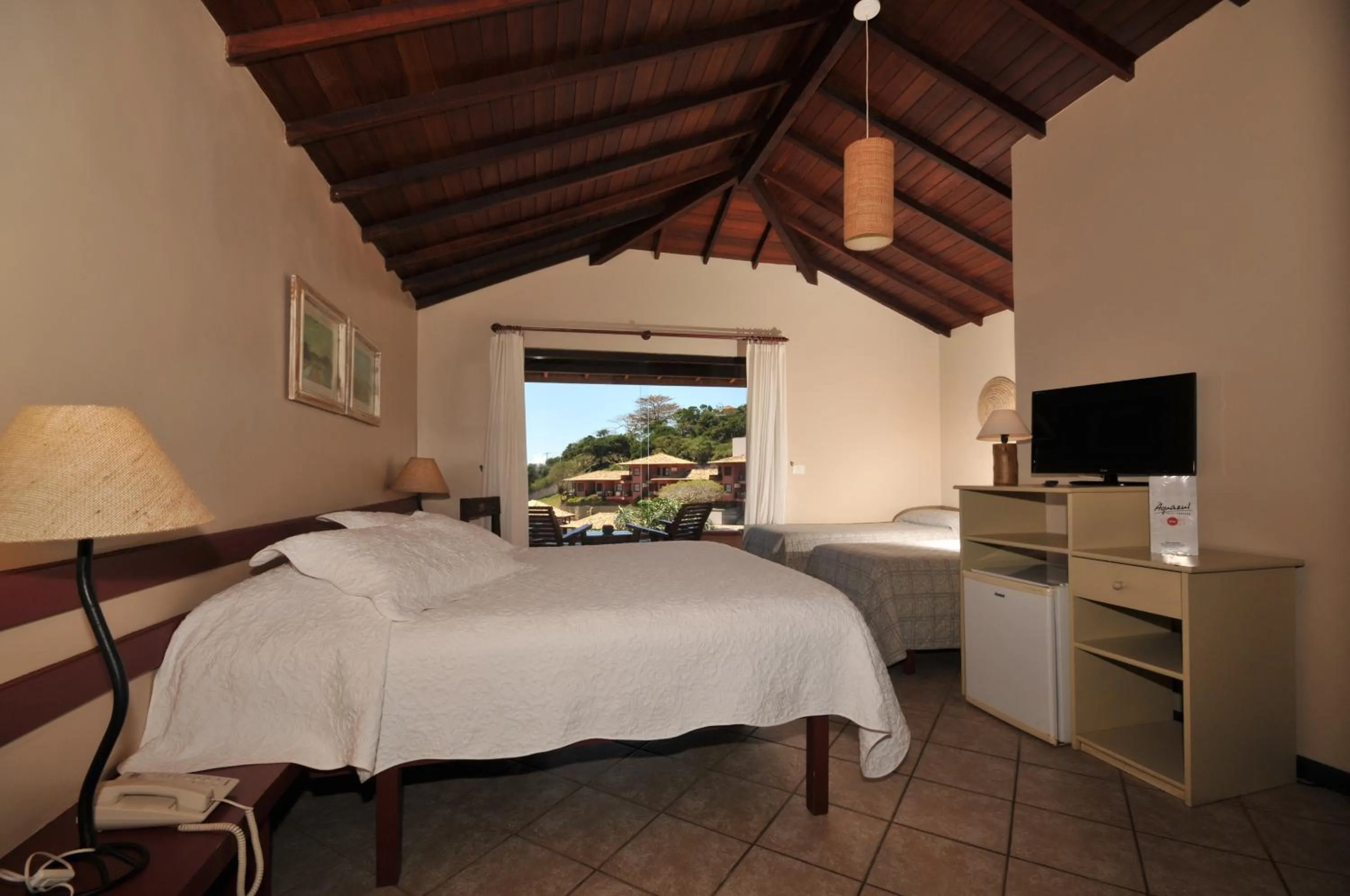 Bed in Aguabúzios Hotel