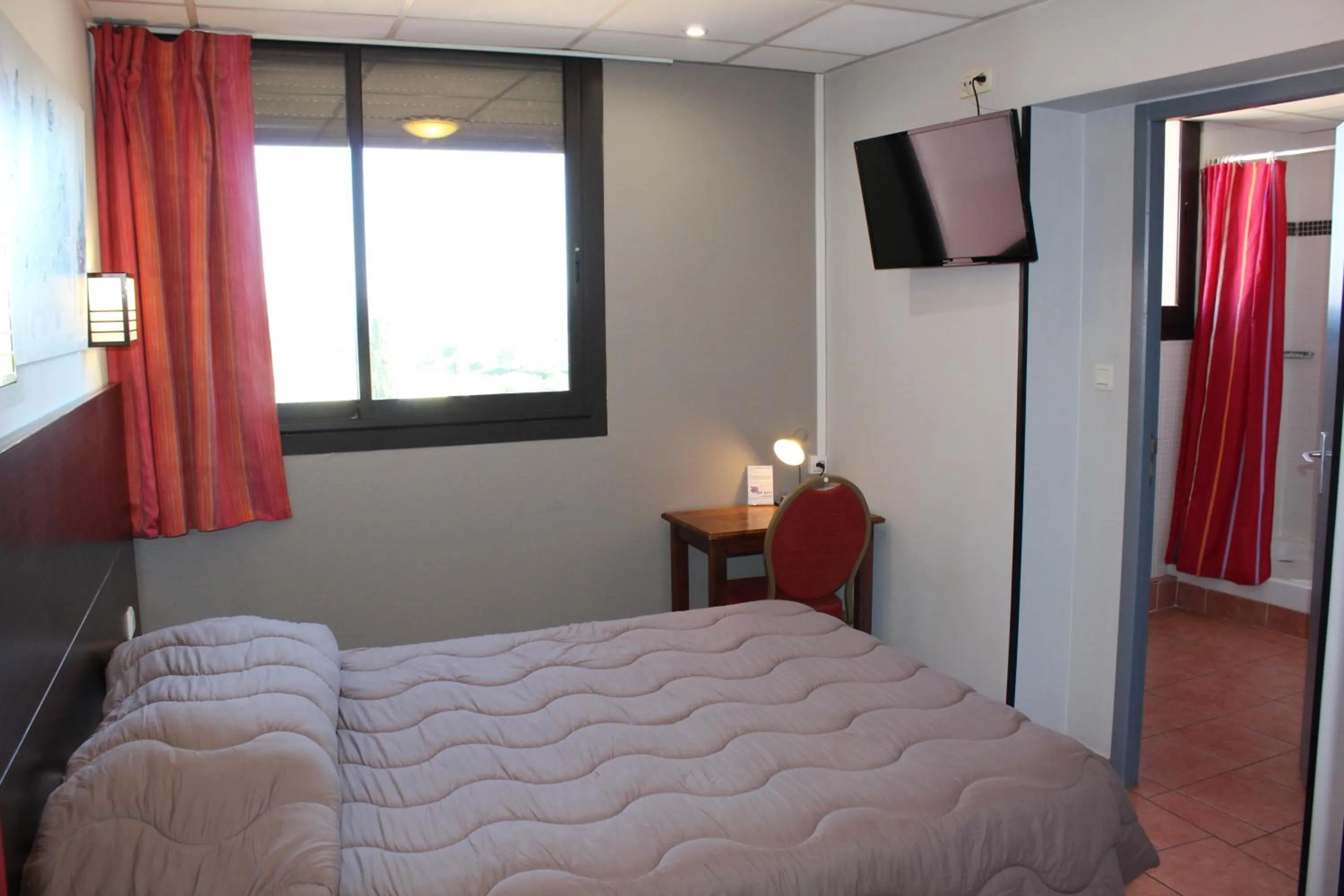 Bed in Hôtel L'Hacienda