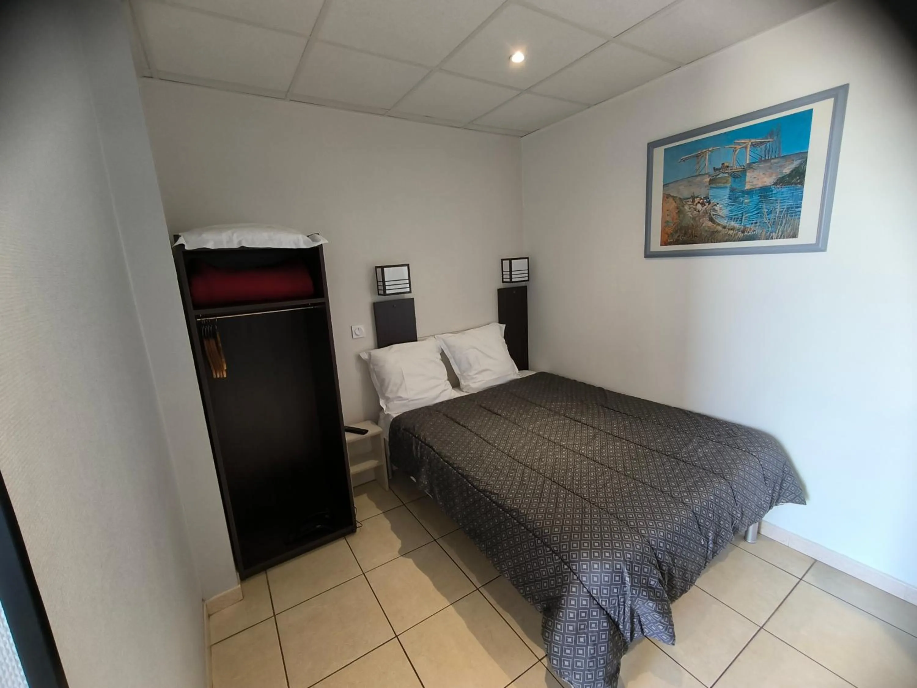 Bed in Hôtel L'Hacienda