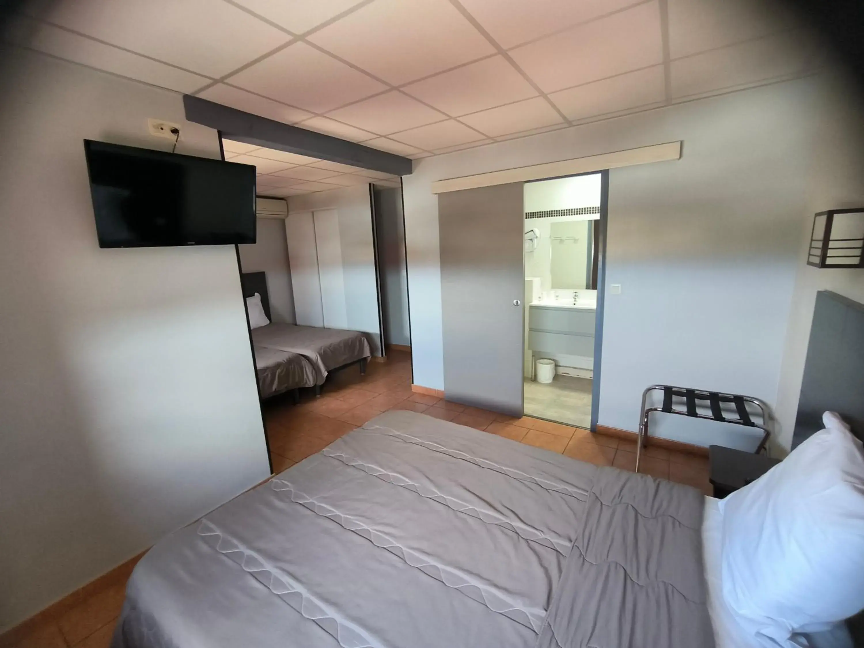 Quadruple Room - single occupancy in Hôtel L'Hacienda Quadruple Room - single occupancy in Hôtel L'Hacienda