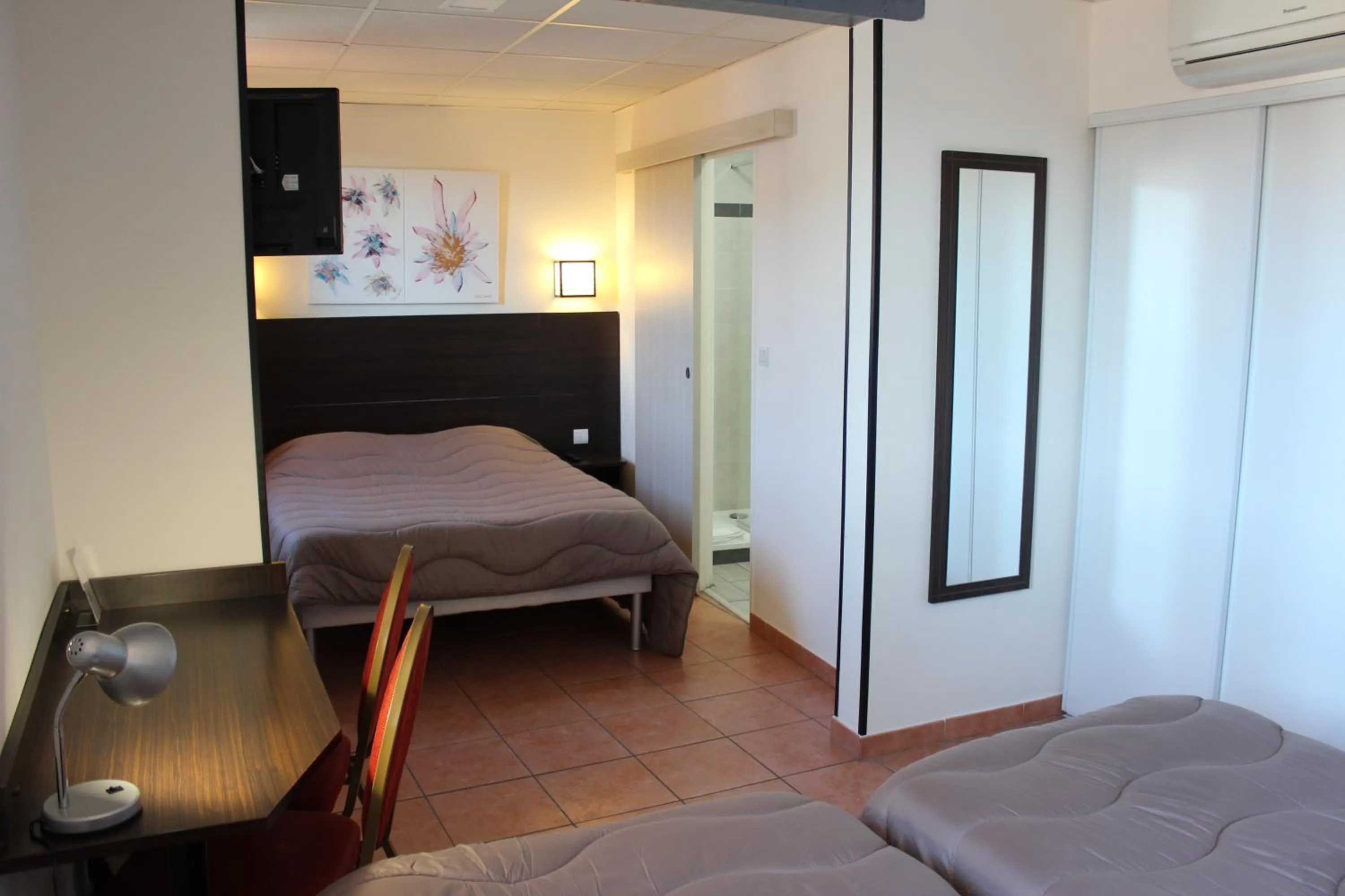 Bed in Hôtel L'Hacienda