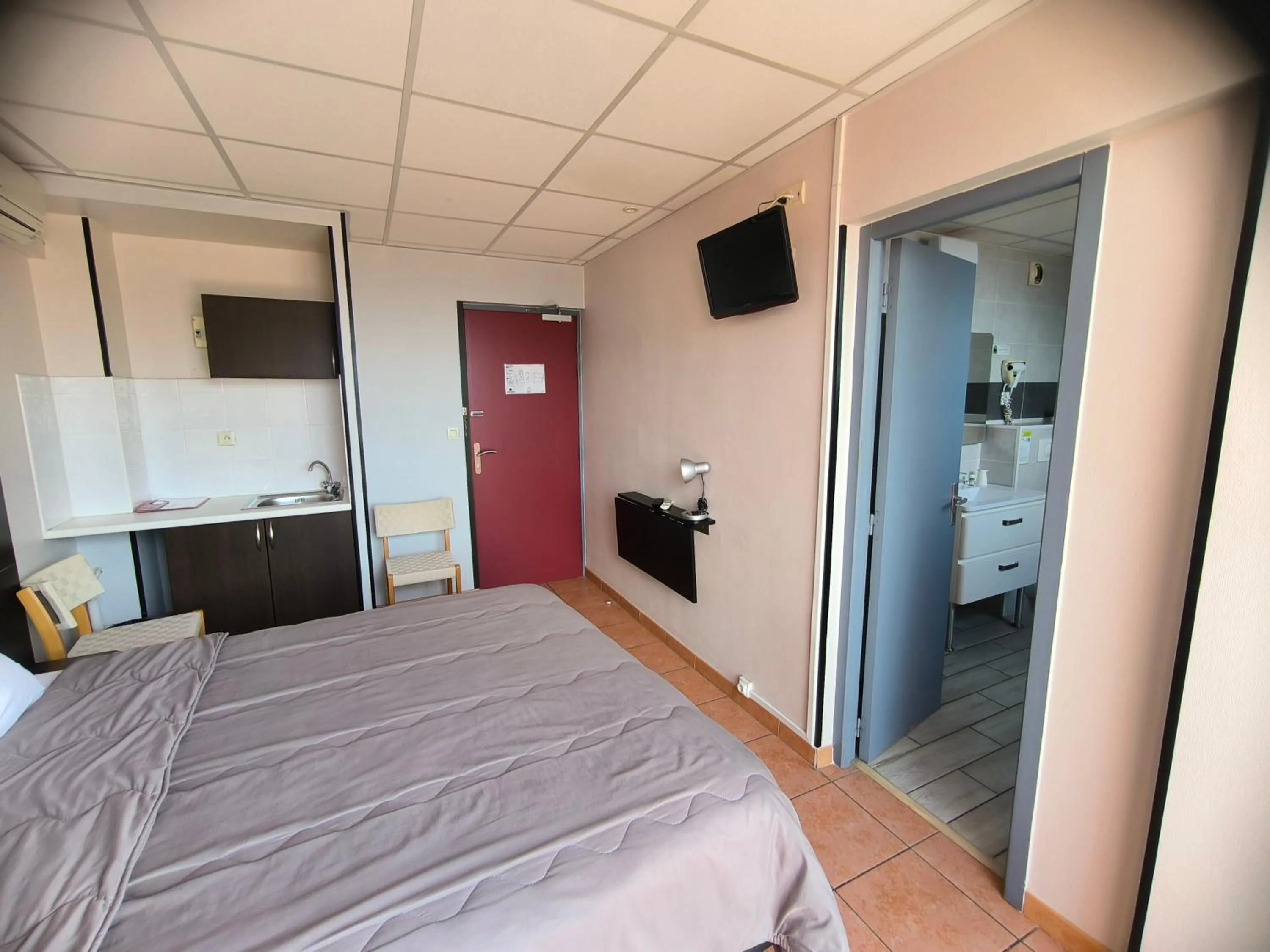 Bed in Hôtel L'Hacienda