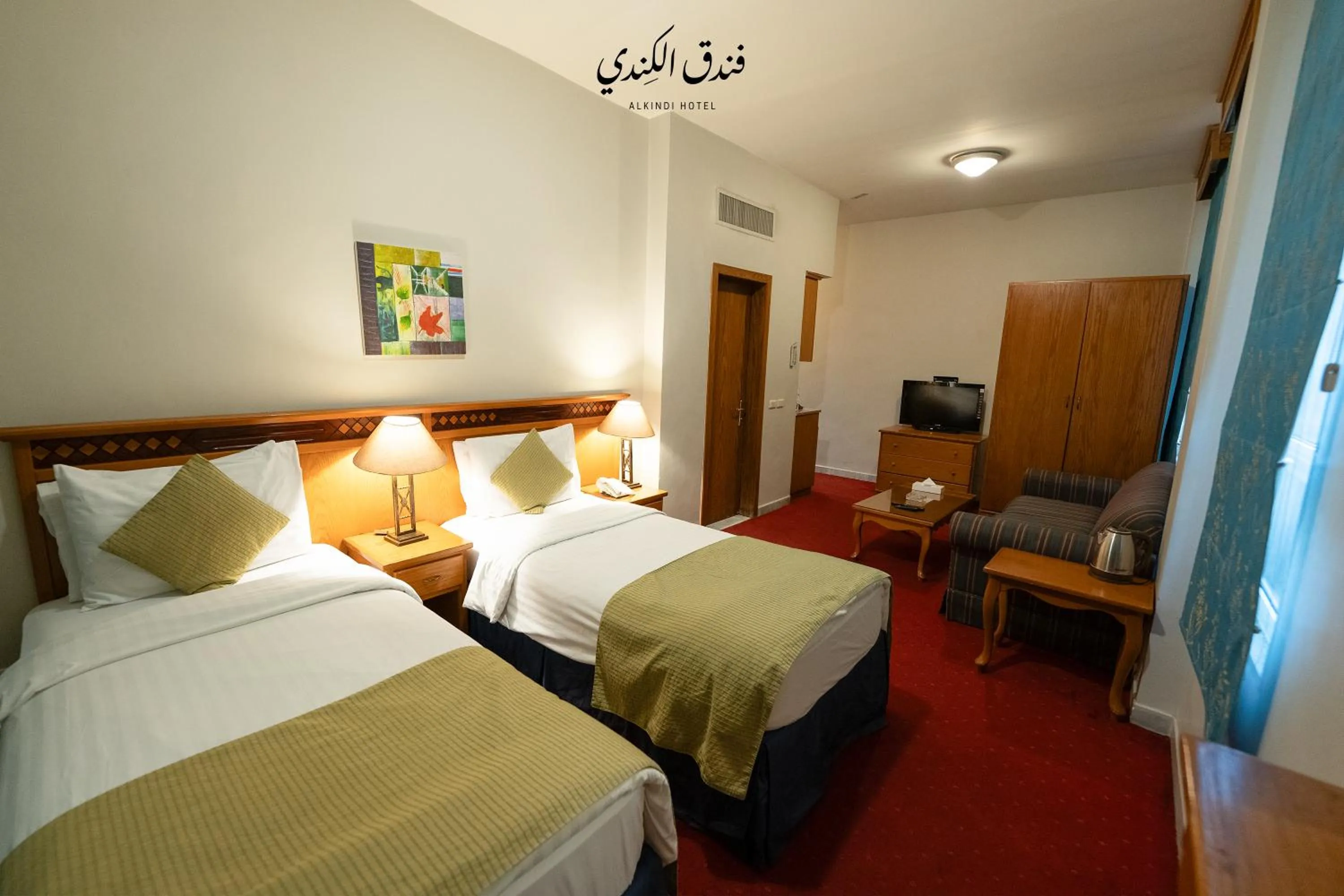 Bed in Kindi Suite Hotel