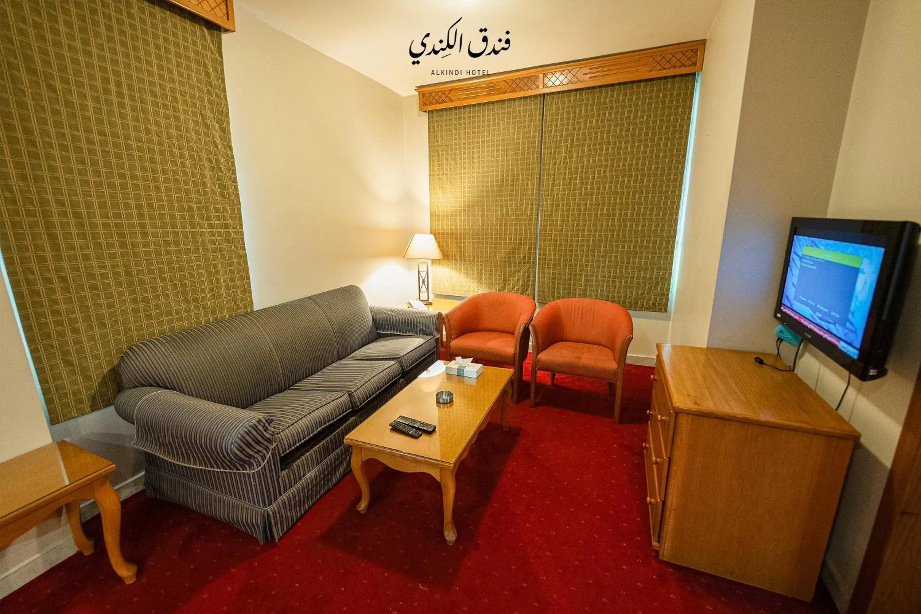 TV and multimedia in Kindi Suite Hotel