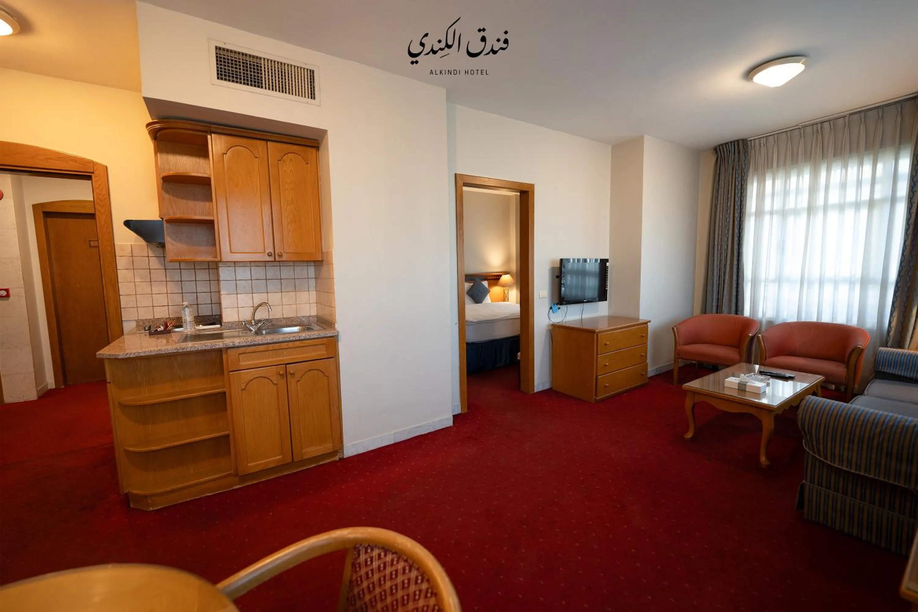 TV and multimedia in Kindi Suite Hotel