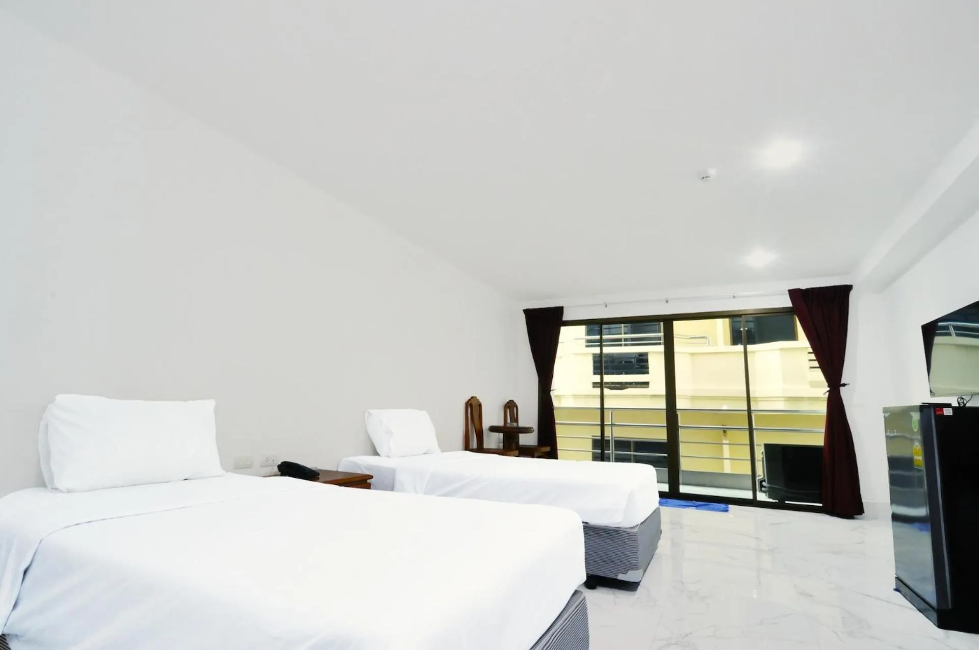 Bed in Highfive Hotel Pattaya