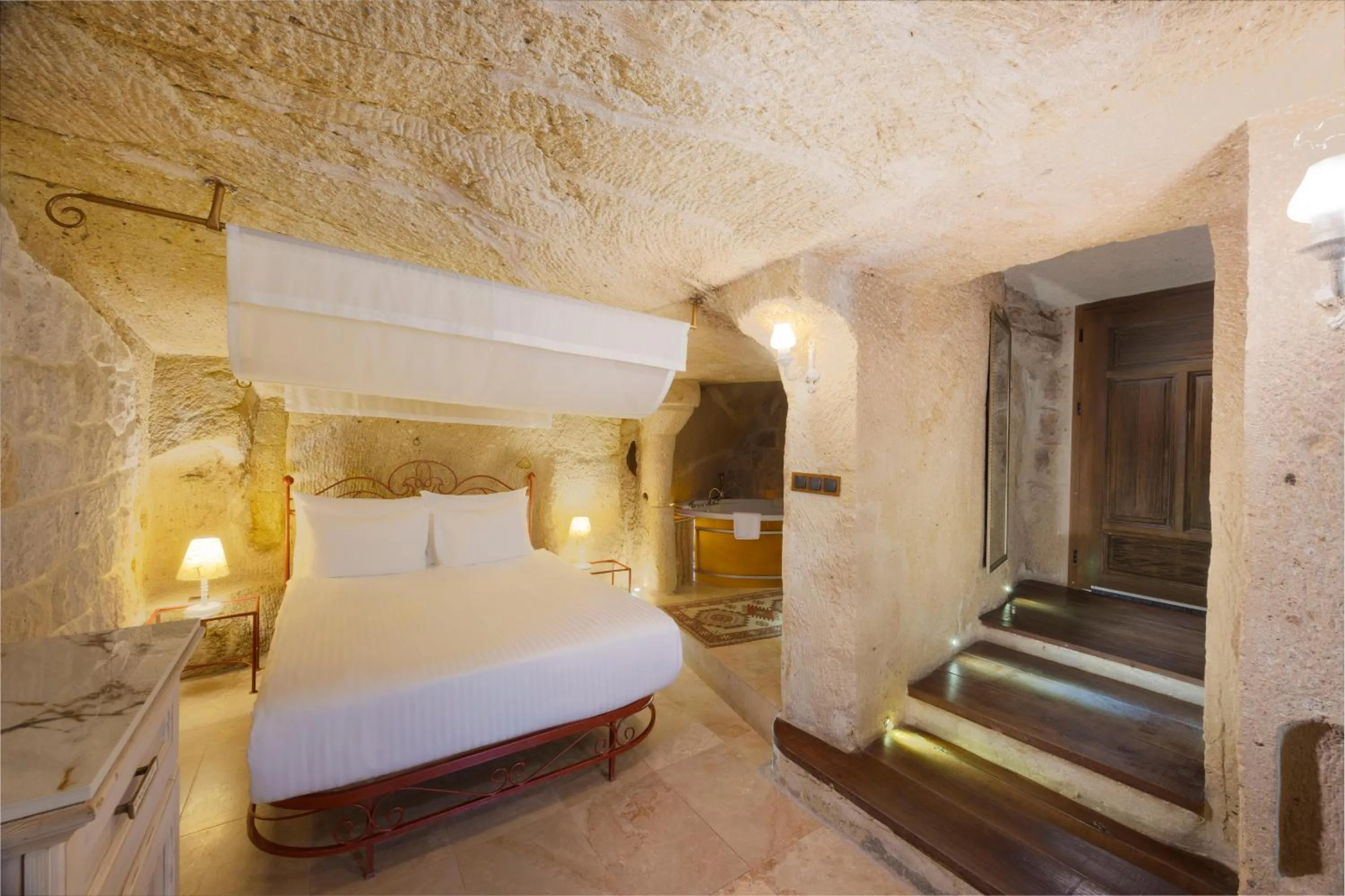 Photo of the whole room, Bed in Tafoni Houses Cave Hotel