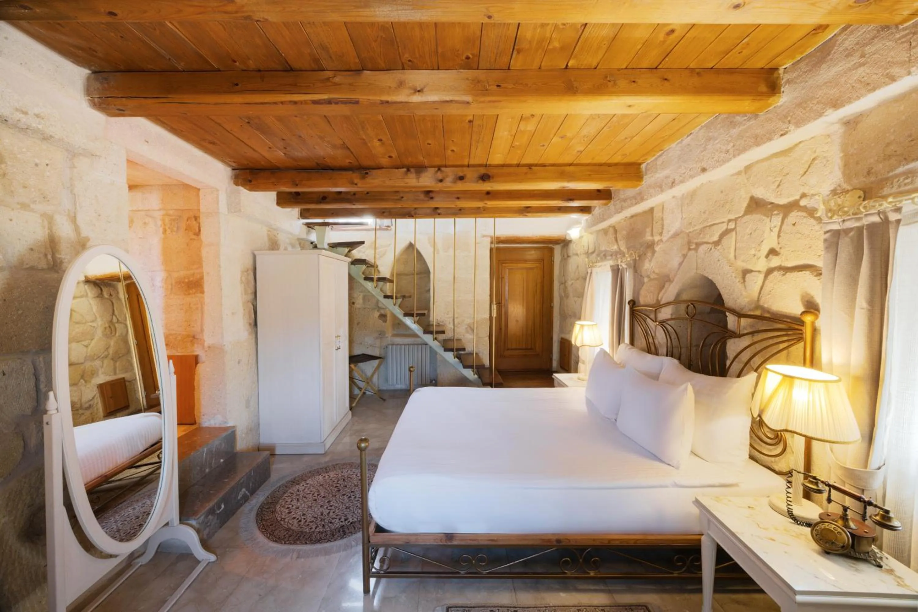 Photo of the whole room, Bed in Tafoni Houses Cave Hotel