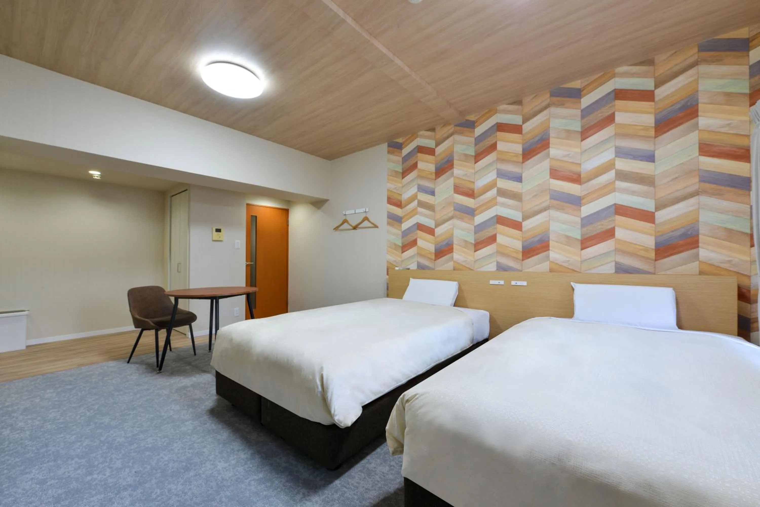 Bed in Hotel New Gaea Yakuin