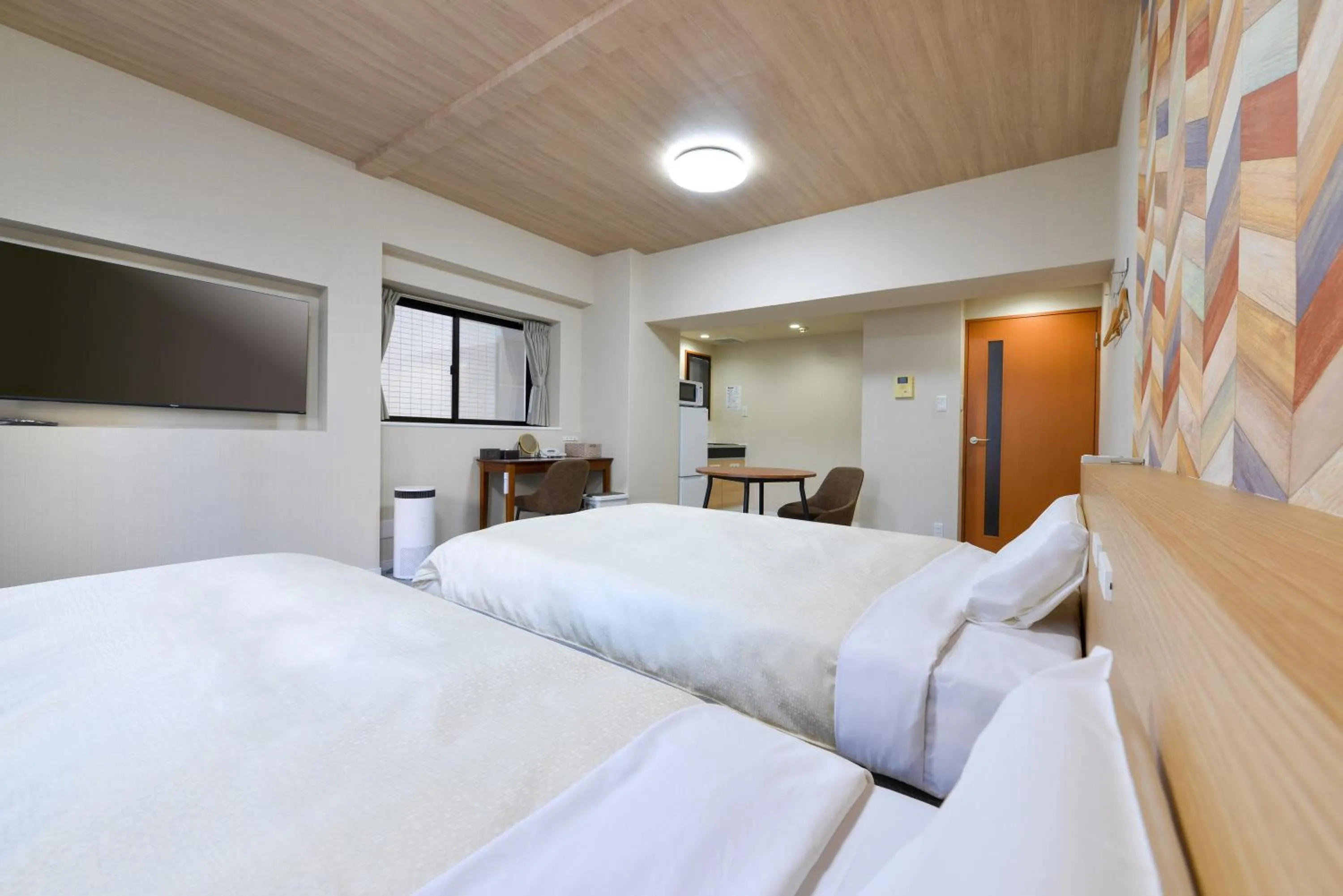 Kitchen or kitchenette, Bed in Hotel New Gaea Yakuin