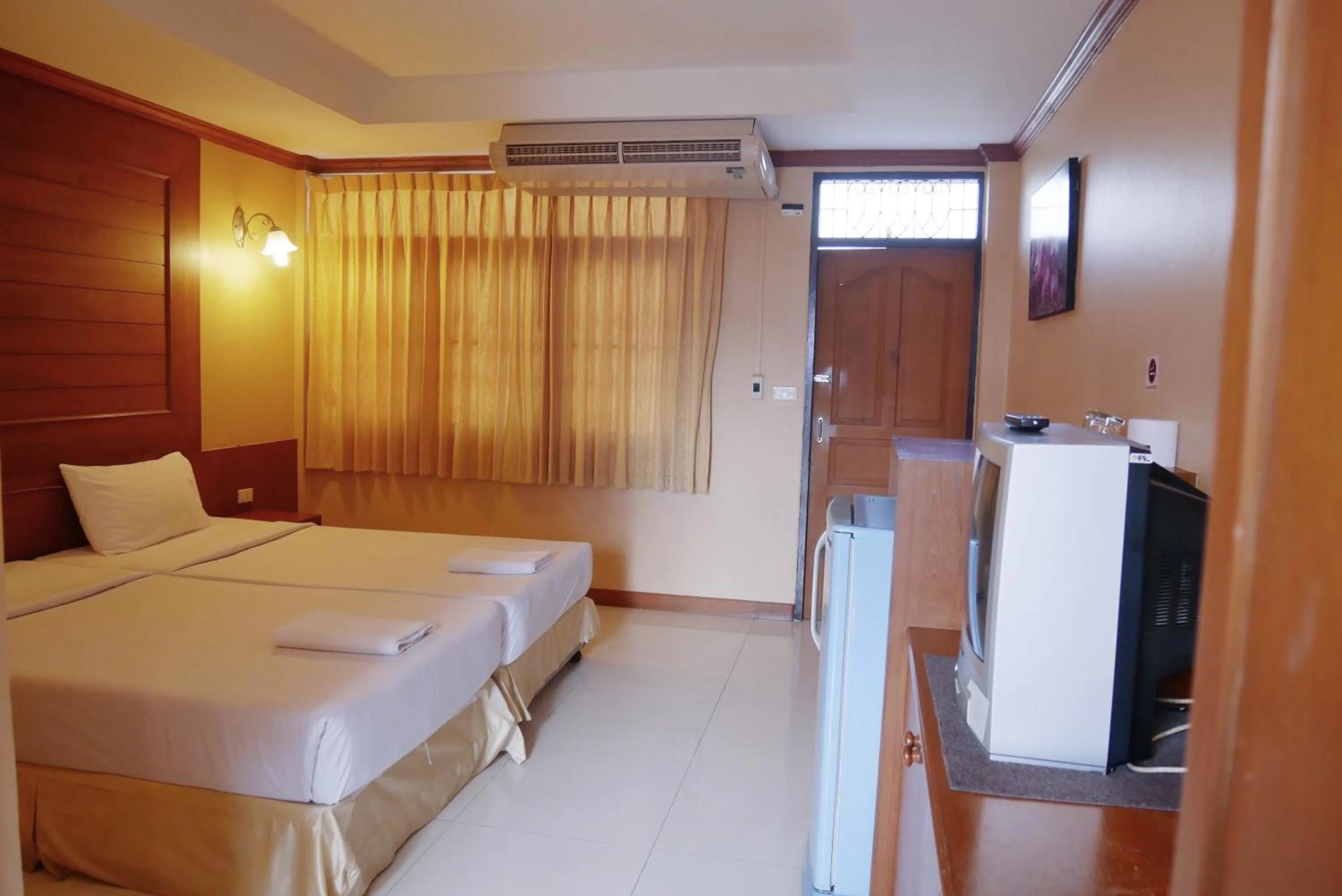 Bed in Baan JPN Hotel