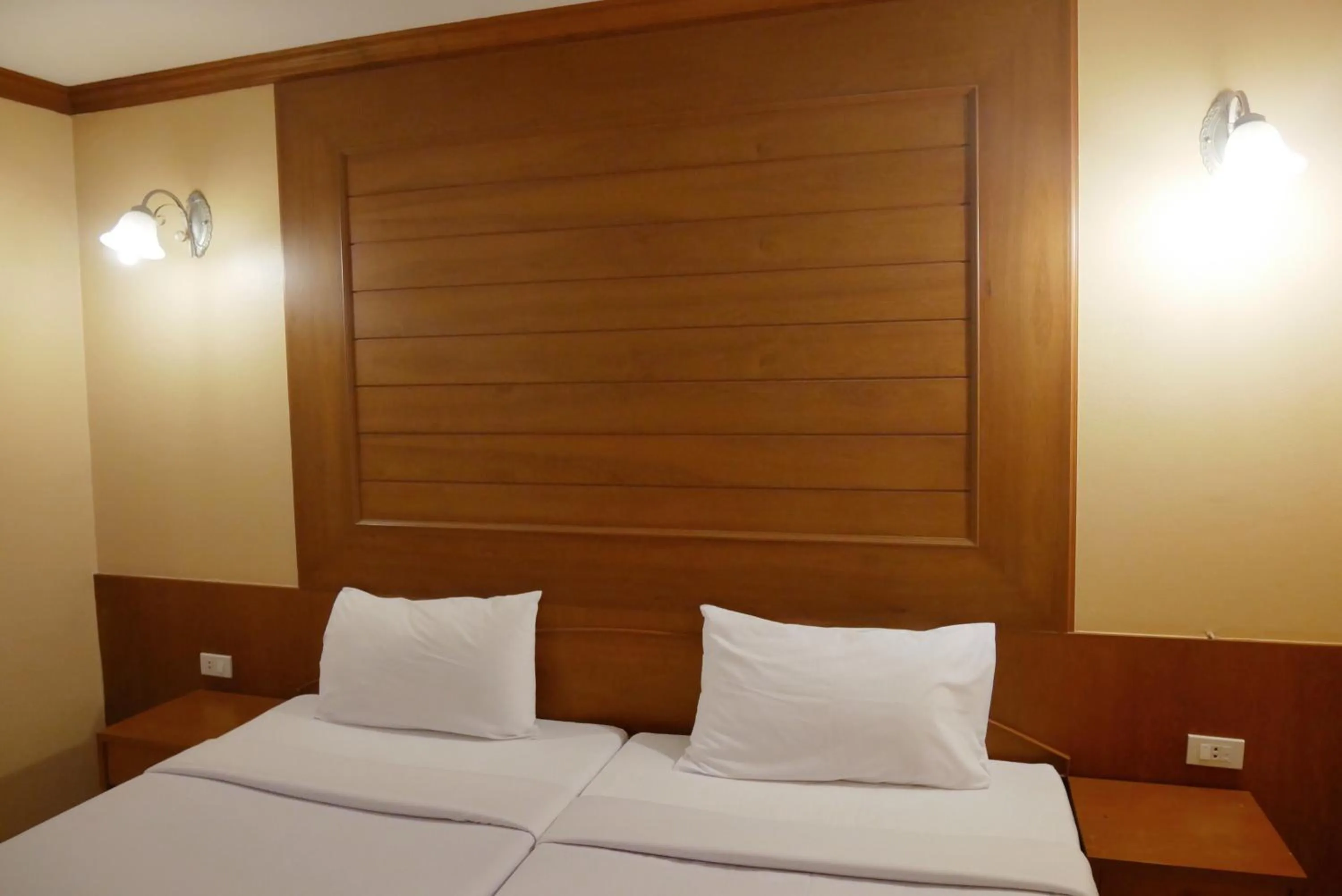 Bed in Baan JPN Hotel