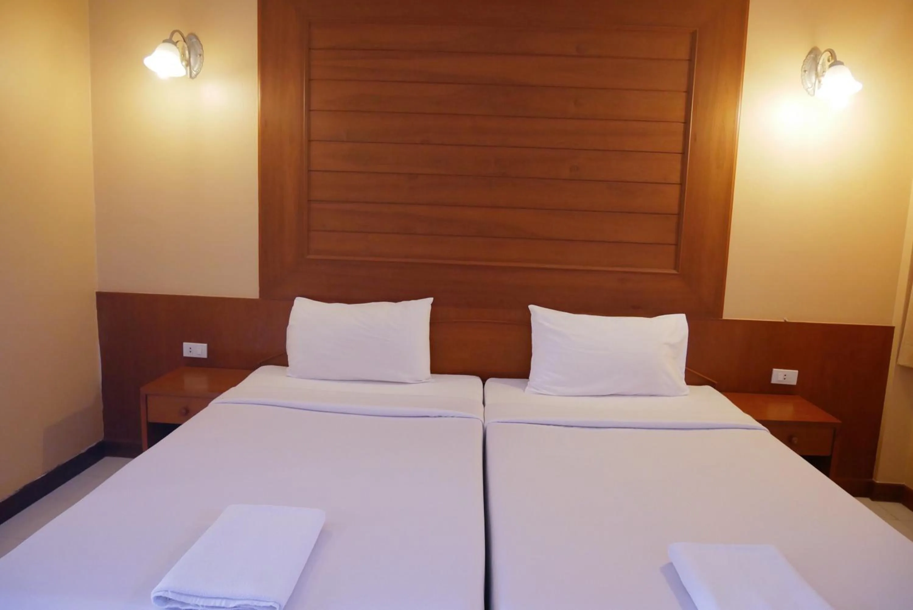 Bed in Baan JPN Hotel