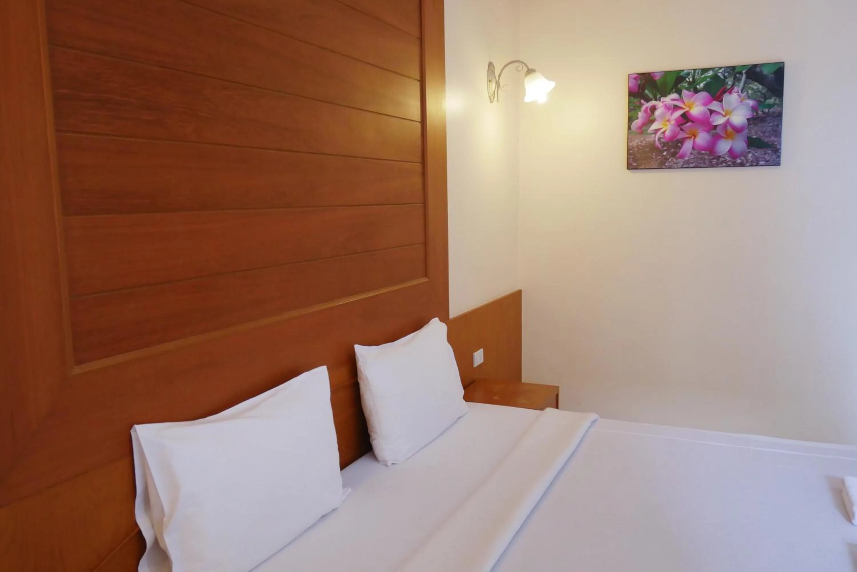 Bed in Baan JPN Hotel