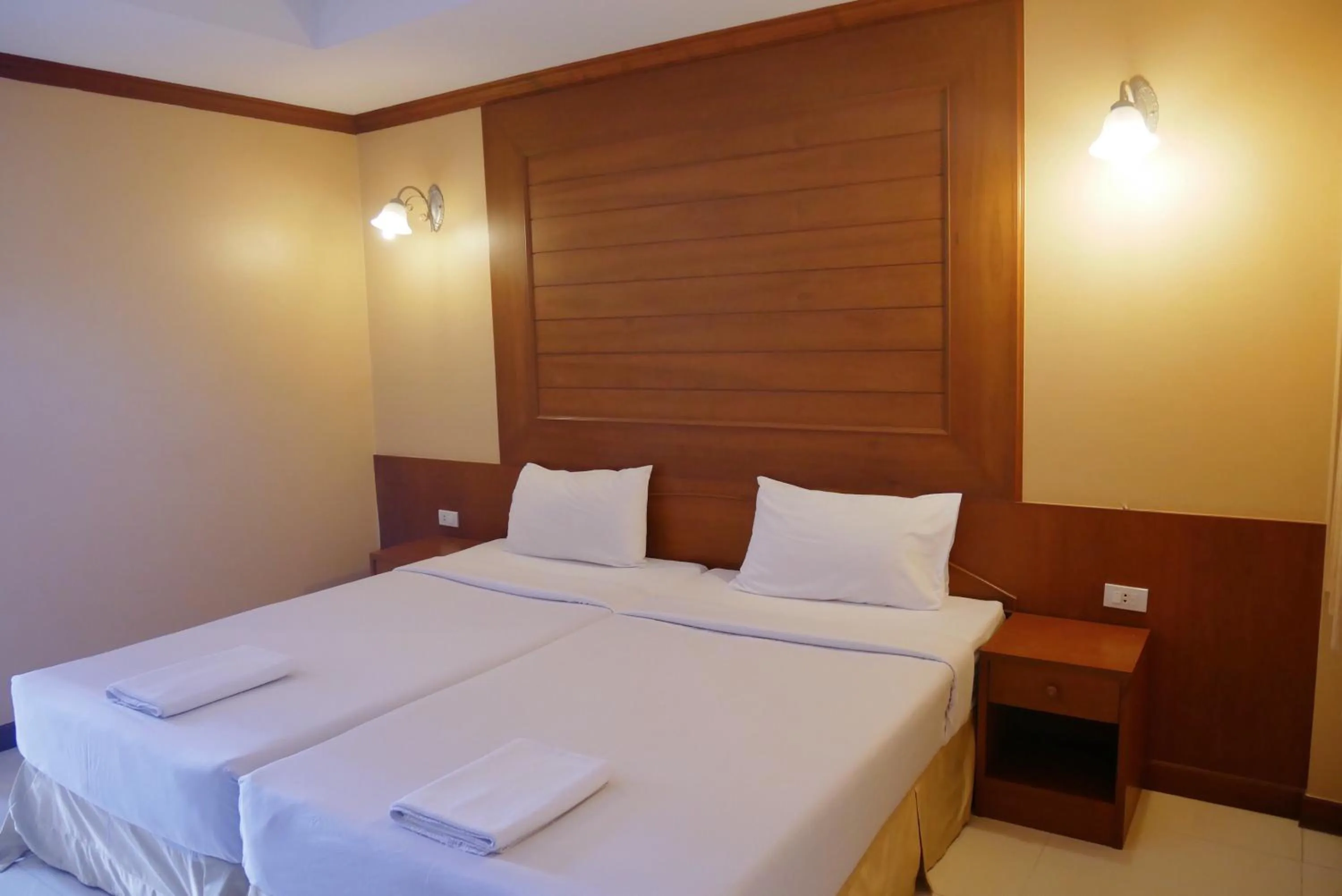 Bed in Baan JPN Hotel