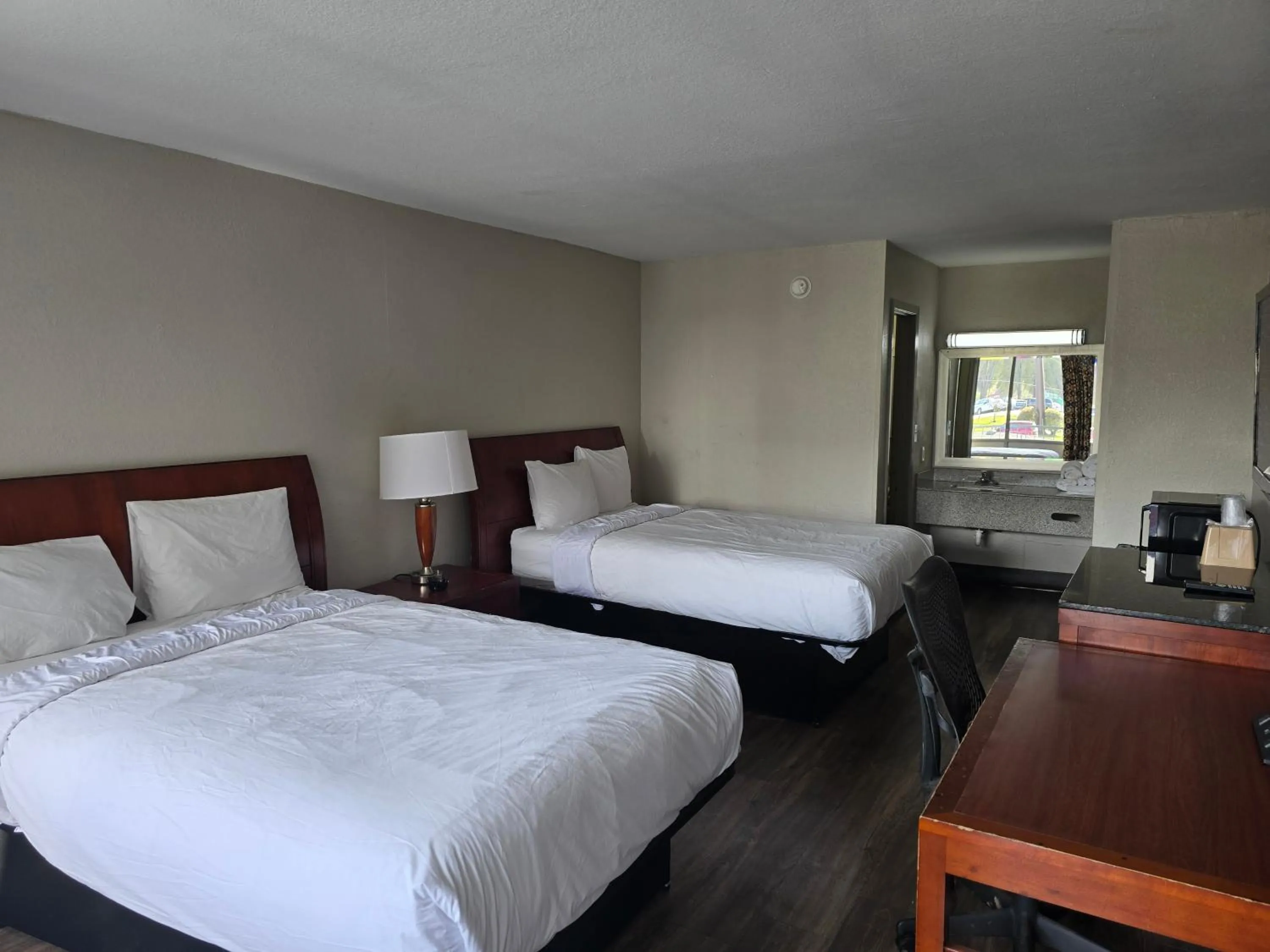 Bedroom in Days Inn by Wyndham Raleigh South