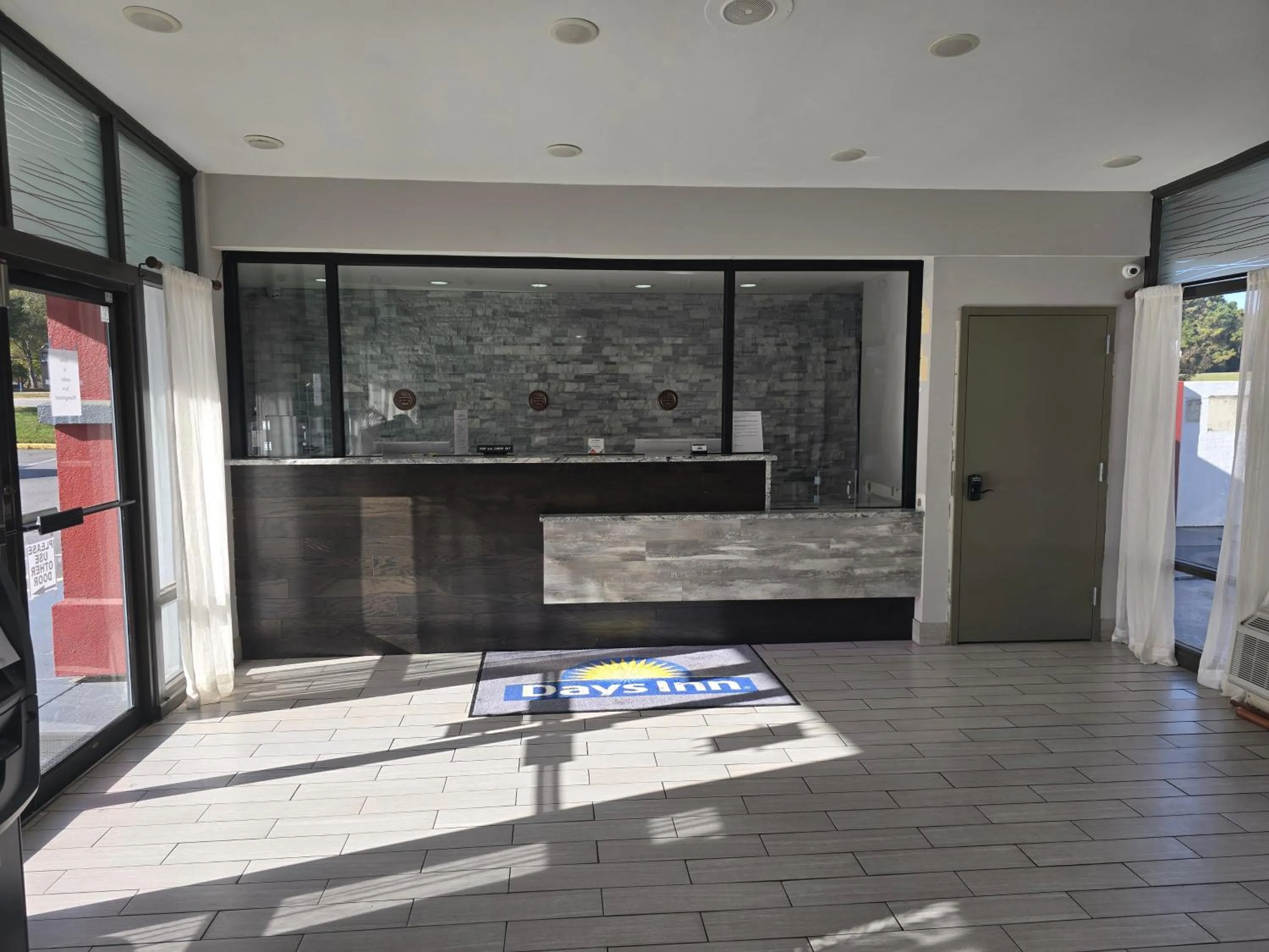Lobby or reception in Days Inn by Wyndham Raleigh South